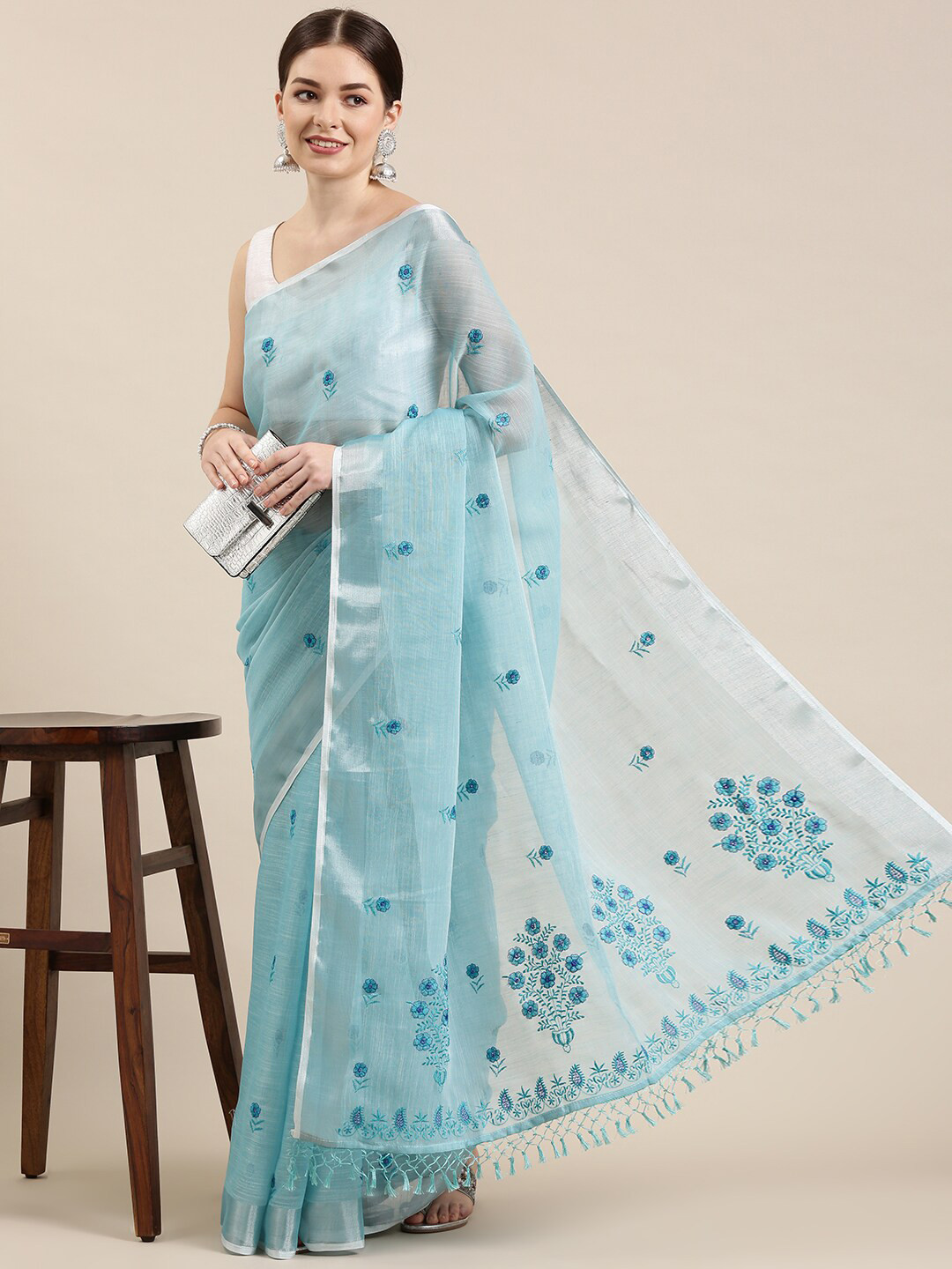 

The Chennai Silks Blue & Silver-Toned Floral Embroidered Linen Blend Saree