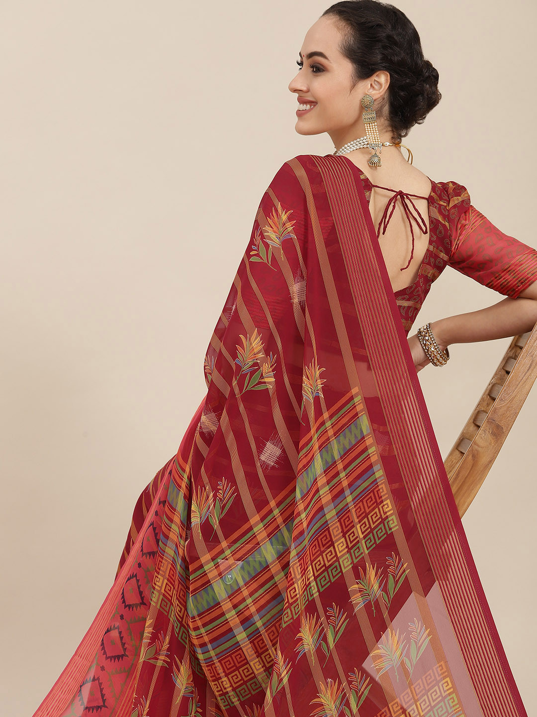 

Mitera Maroon & Beige Ethnic Motifs Saree