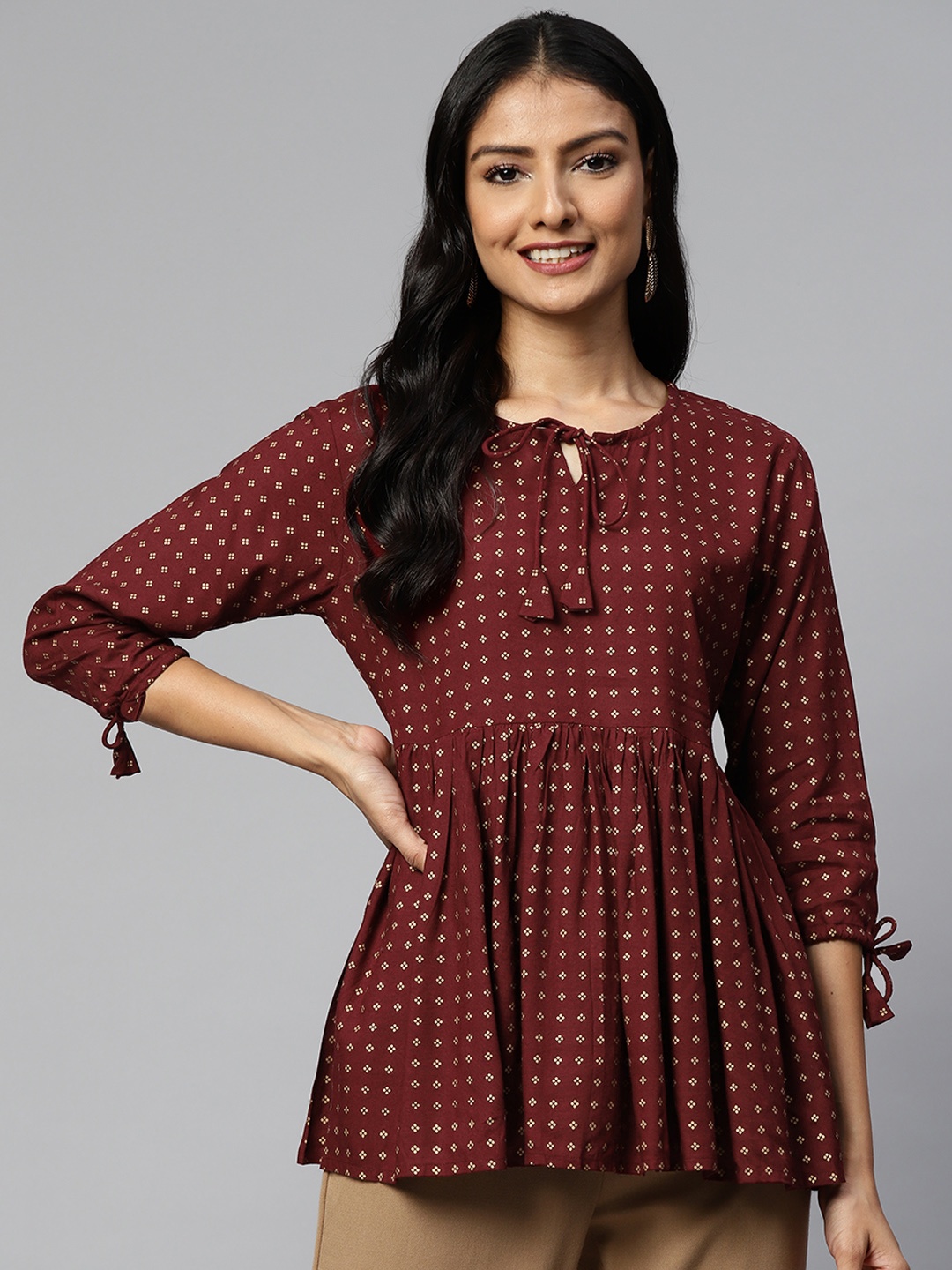 

HIGHLIGHT FASHION EXPORT Maroon Print Tie-Up Neck Empire Top