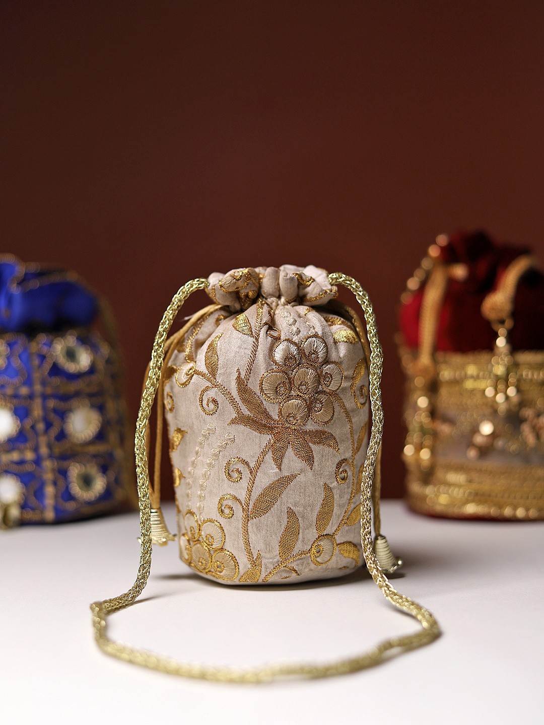 

LIKAA Beige & Gold-Toned Embroidered Potli Clutch