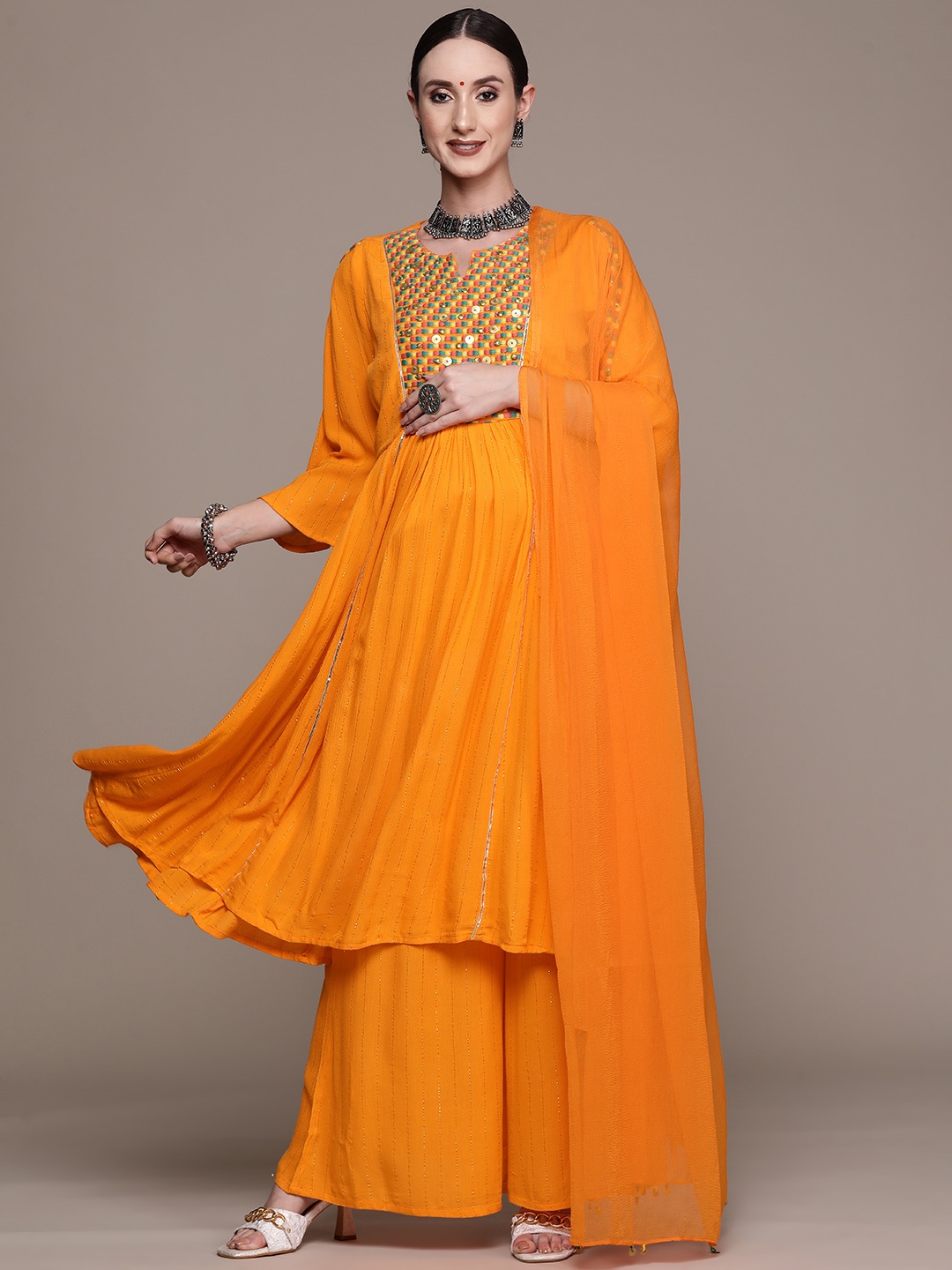 

Ishin Women Orange Embroidered Thread Work Kurta with Sharara & With Dupatta