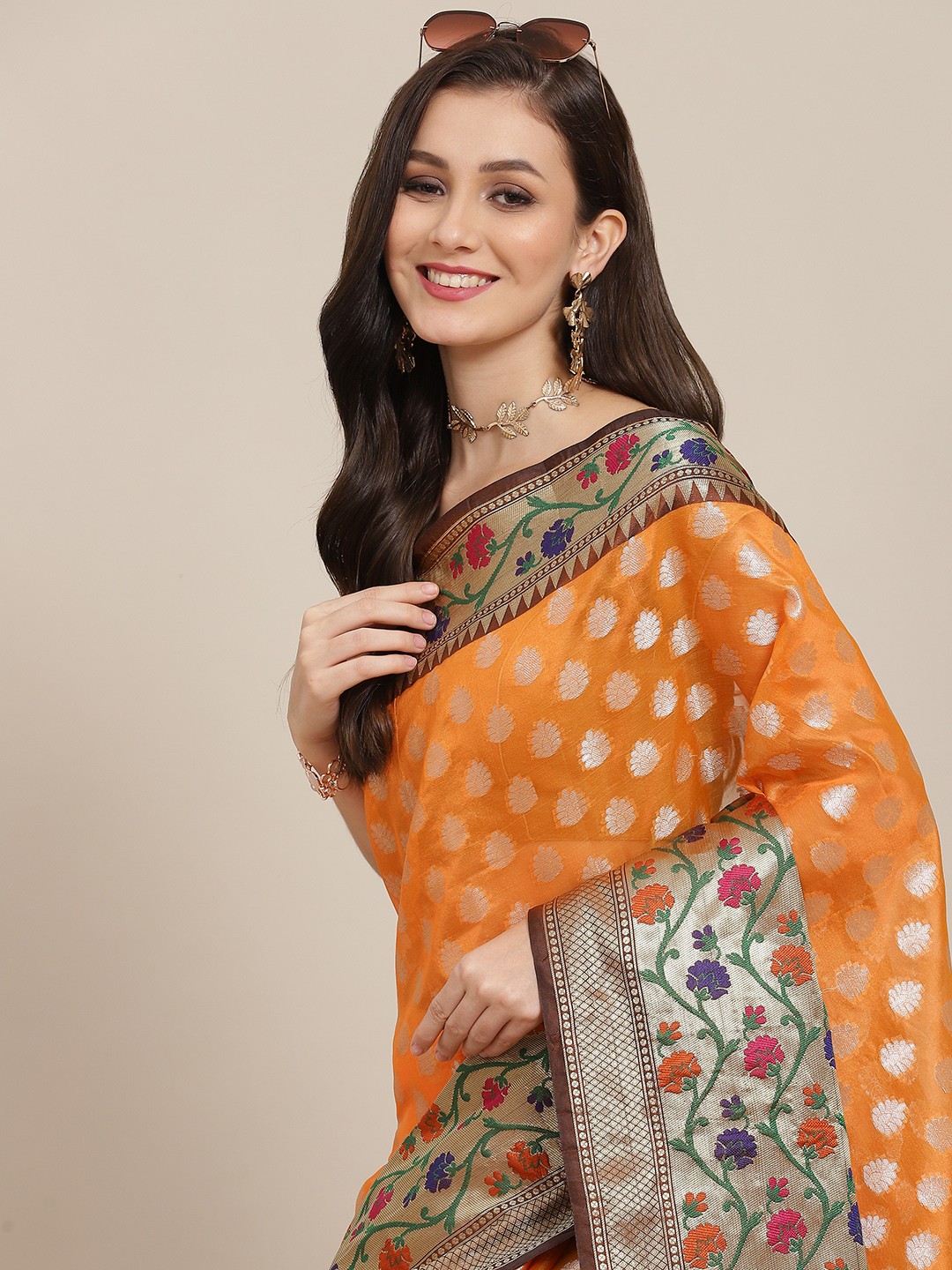 

Silk Land Orange & Silver-Toned Ethnic Motifs Zari Art Silk Banarasi Saree