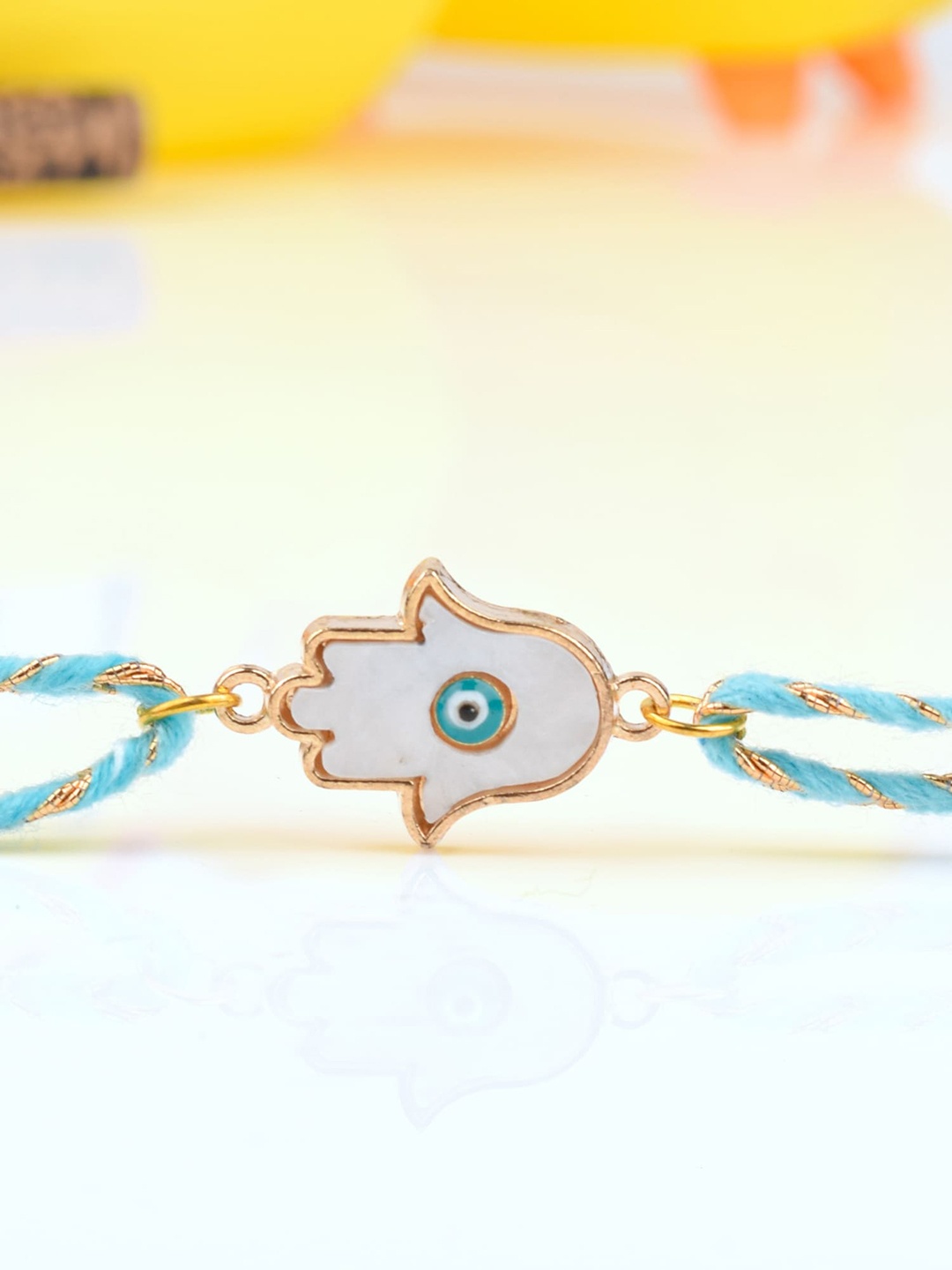 

Bigsmall Unisex White Hamsa Evil Eye Metallic & Blue Thread Rakhi