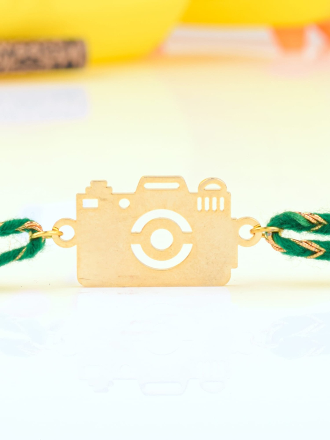 

Bigsmall Unisex Gold-Toned & Green Camera Metallic Rakhi