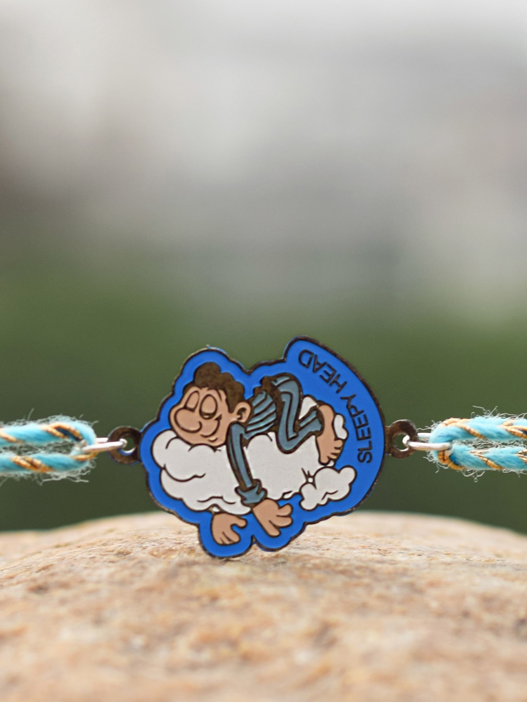 

Bigsmall Silver-Toned & Blue Sleepy Head Beaded Rakhi