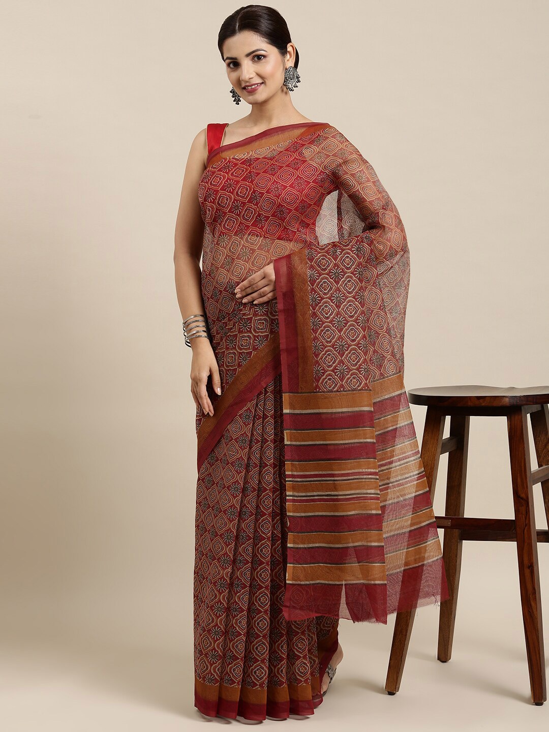 

The Chennai Silks Maroon & Beige Ethnic Motifs Supernet Kota Saree