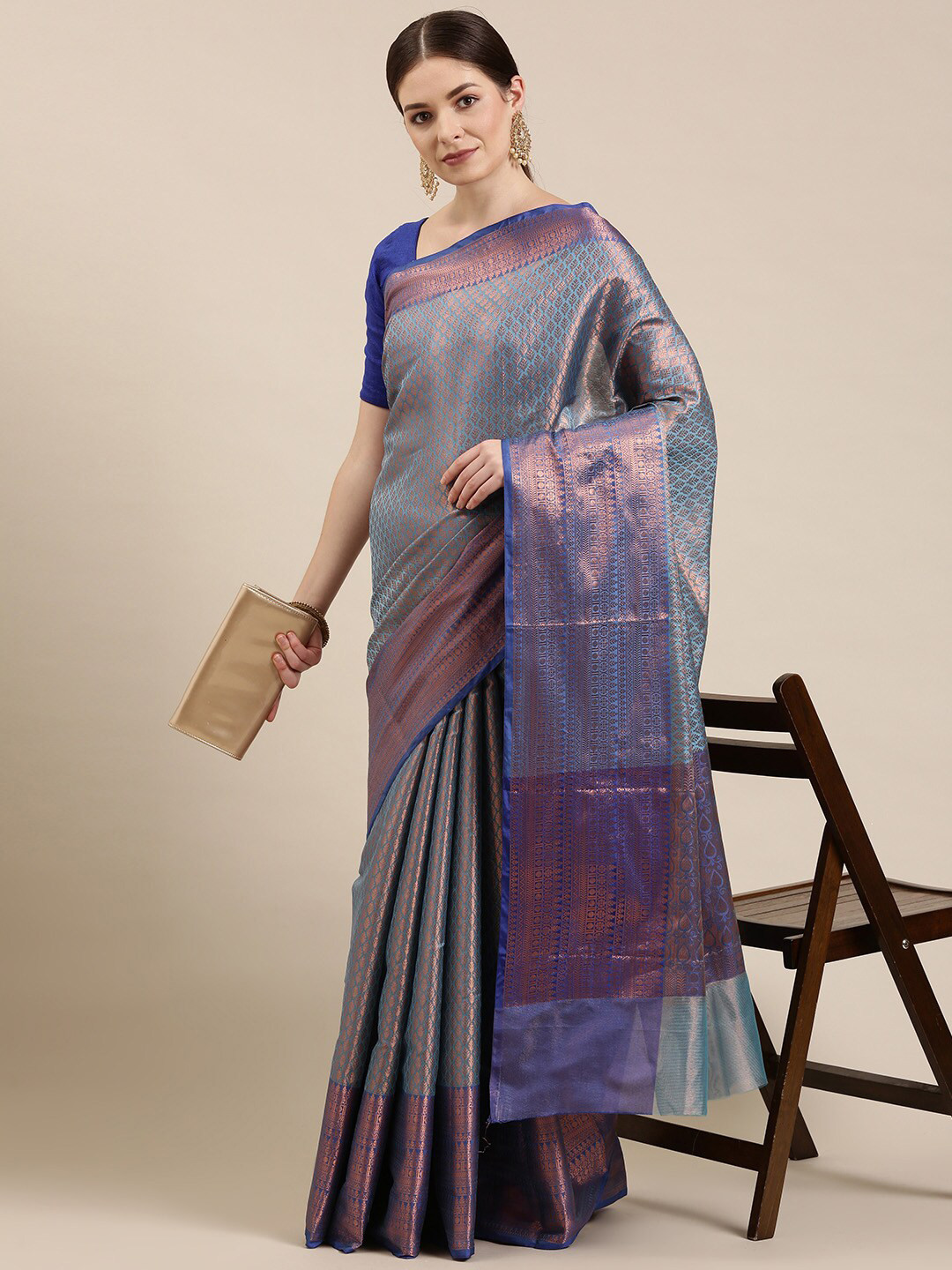 

The Chennai Silks Blue & Gold-Toned Woven Design Zari Organza Banarasi Saree
