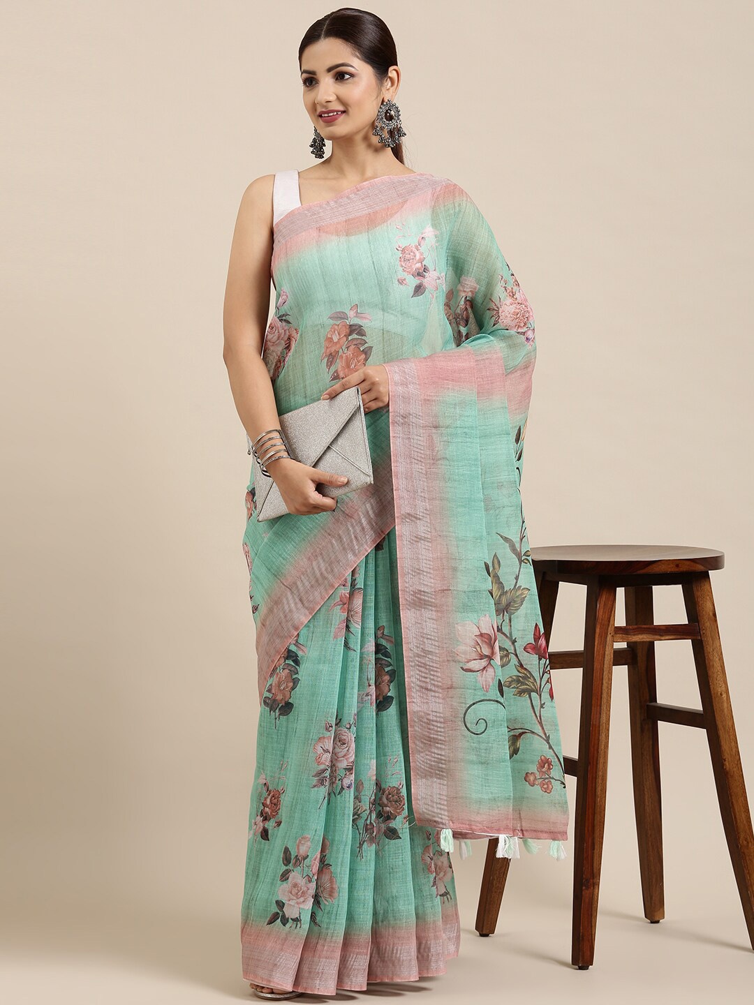 

The Chennai Silks Green & Pink Floral Zari Linen Blend Saree