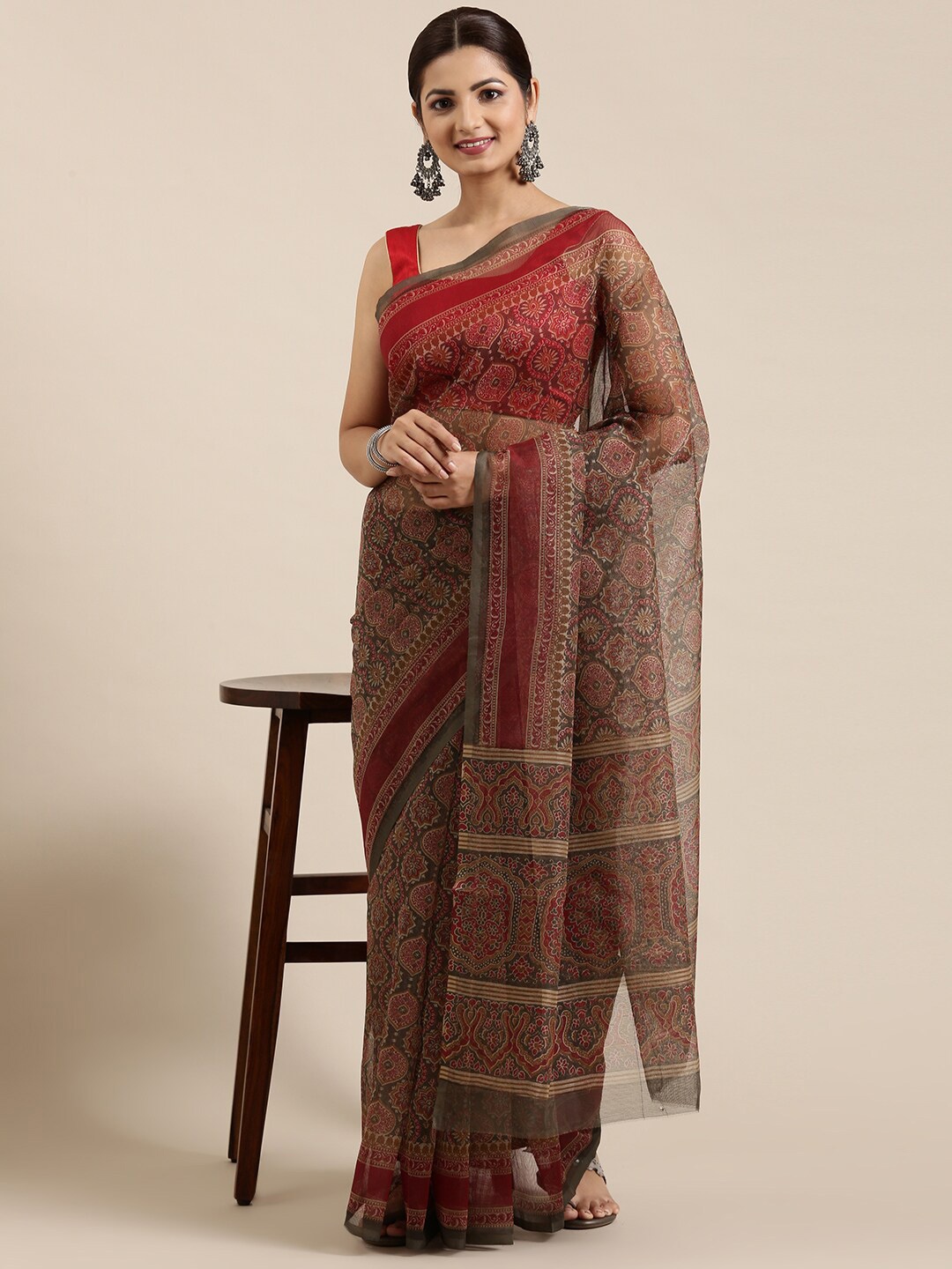 

The Chennai Silks Olive Green & Grey Ajrak Supernet Kota Saree