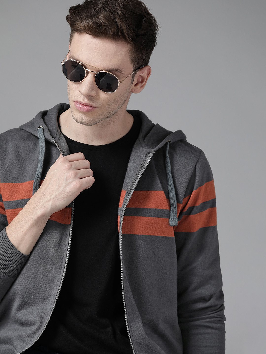

Roadster Men Charcoal Grey & Rust Orange Striped Hooded Sweatshirt