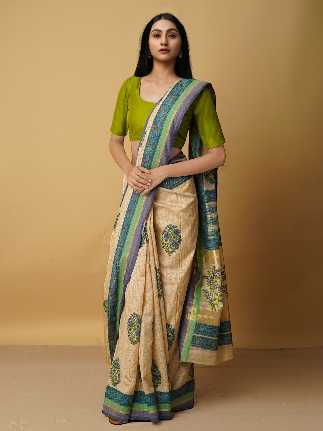 

Unnati Silks Beige & Blue Ethnic Motifs Silk Blend Tussar Saree