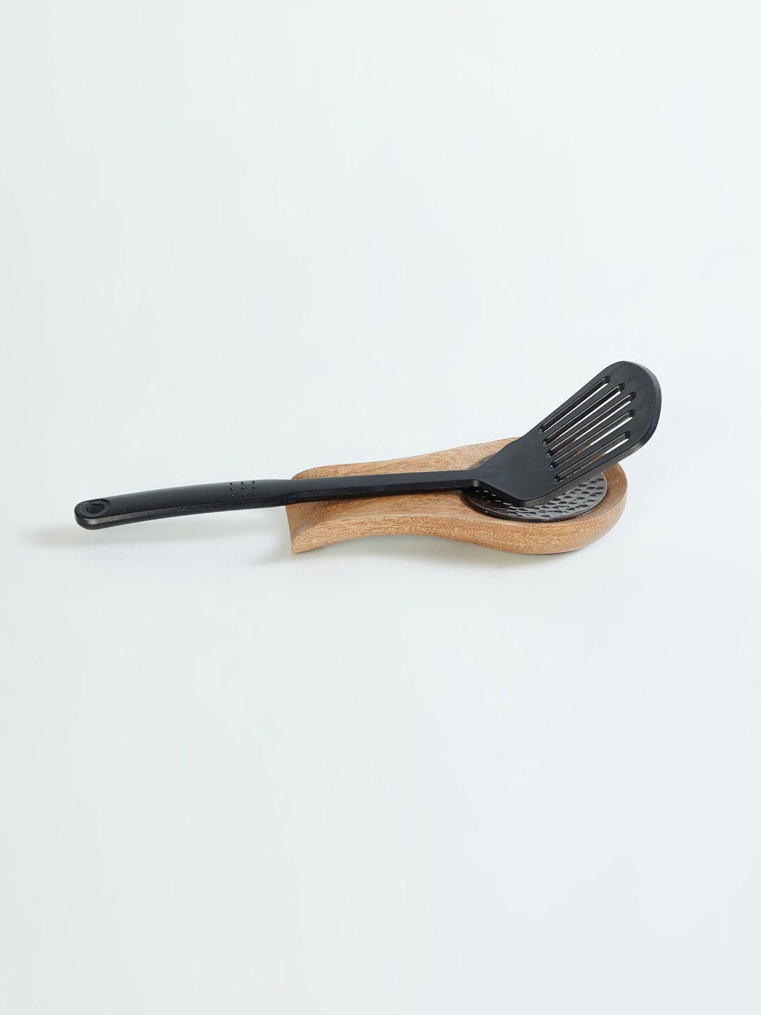 

Home Centre Mirage Kalavera Brown Textured Mango Wood Spoon Rest