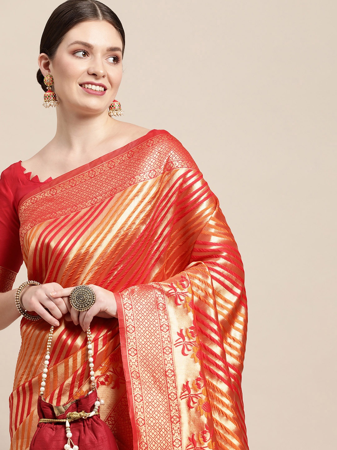 

Saree mall Red & Orange Striped Zari Silk Blend Celebrity Kanjeevaram Sarees