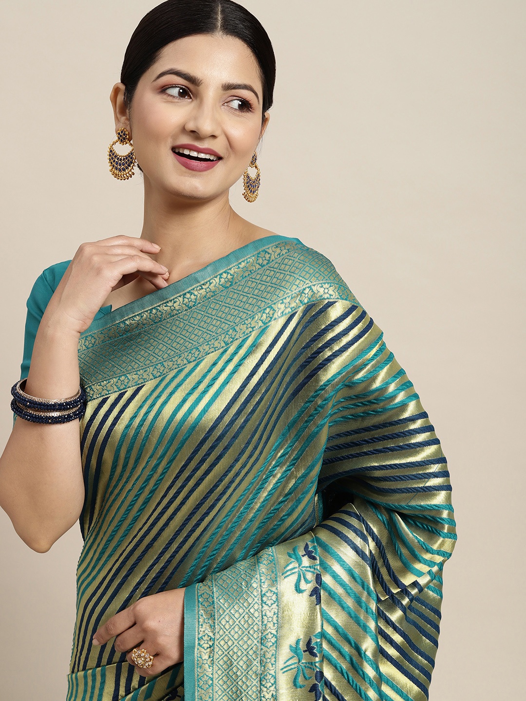 

Saree mall Teal & Navy Blue Striped Zari Silk Blend Kanjeevaram Sarees