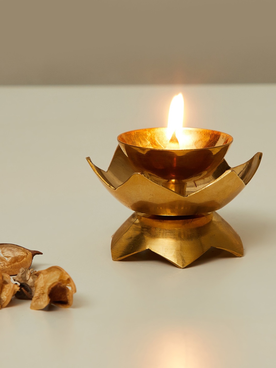 

Home Centre Gold-Toned Lotus-Shaped Brass Diya