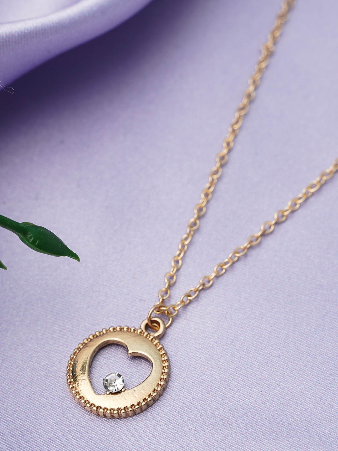 

Emmie Gold-Toned White Stone Studded & Beaded Heart Pendant With Chains