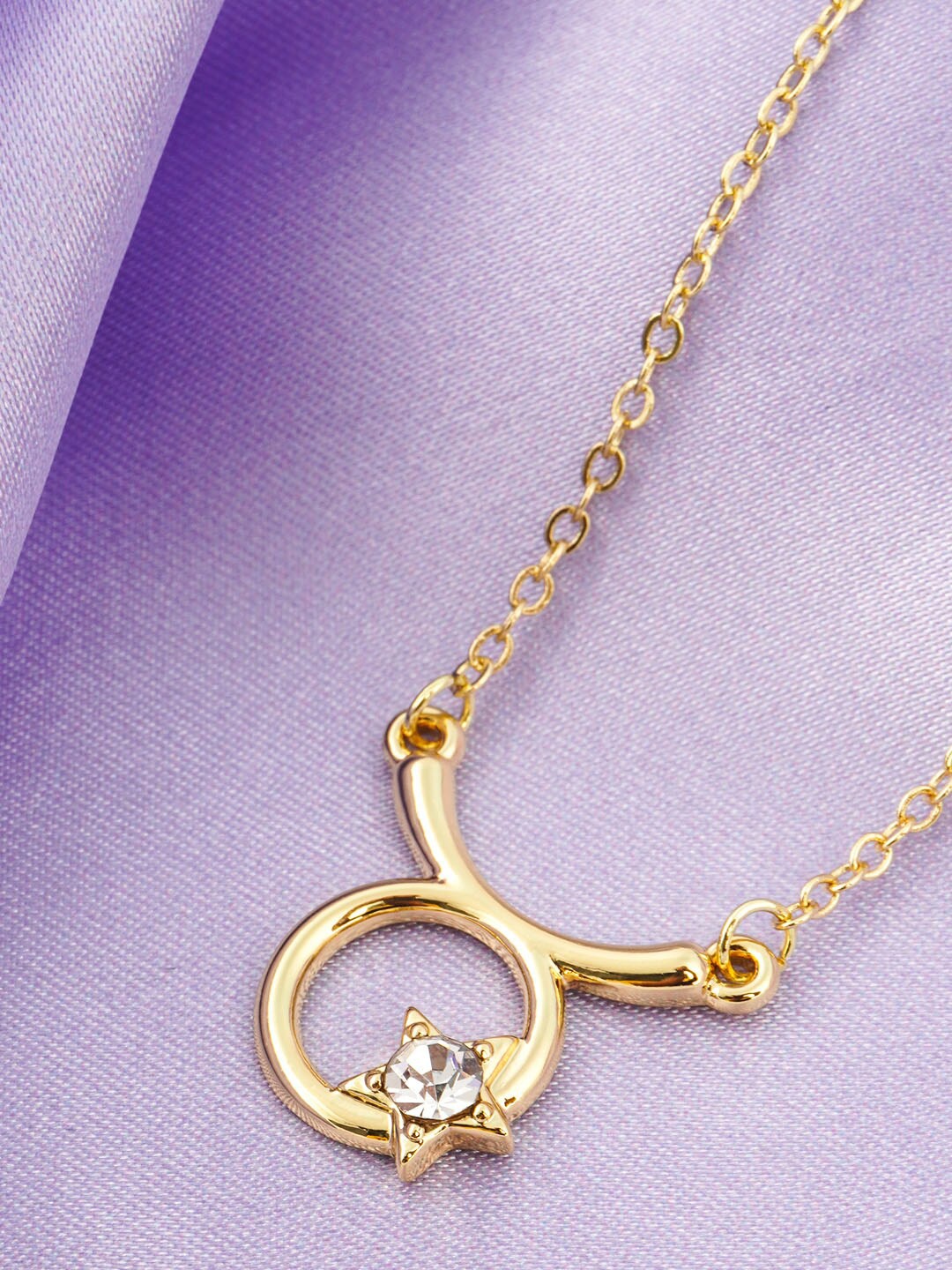

Emmie Women Gold-Toned & Stone-Studded Crystal Star Taurus Pendant With Chain
