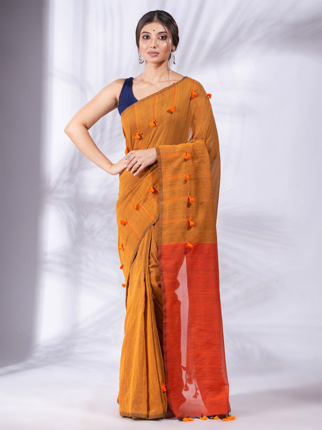 

Charukriti Mustard & Orange Woven Design Pure Cotton Saree
