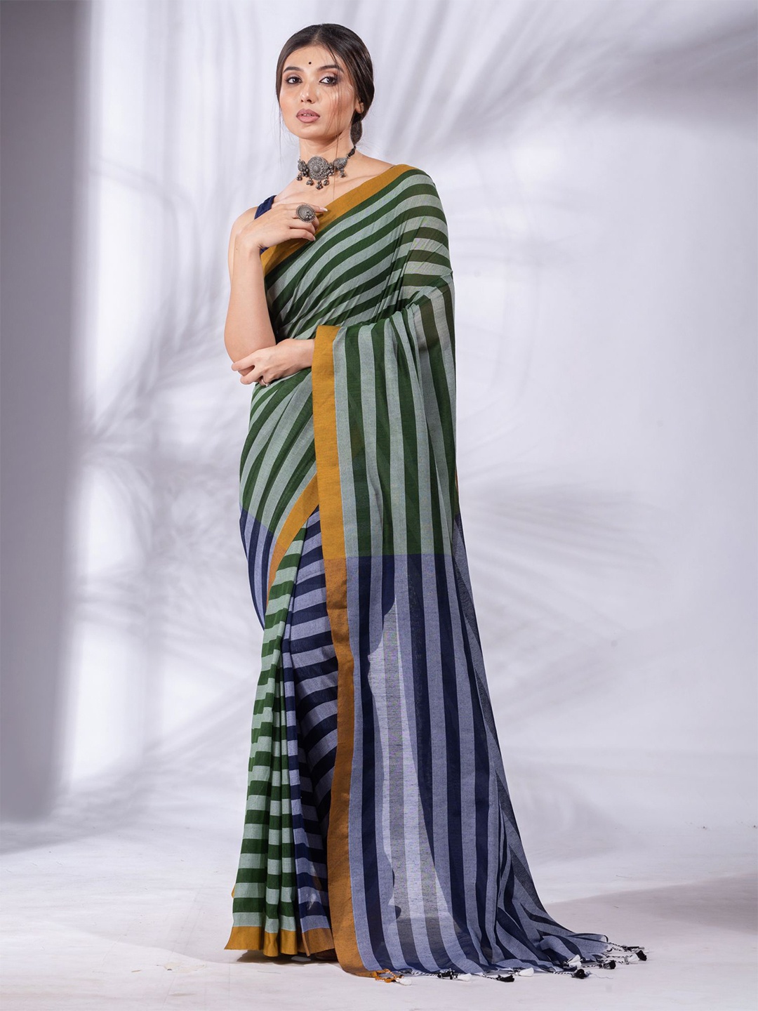 

Charukriti Green & Blue Striped Pure Cotton Saree