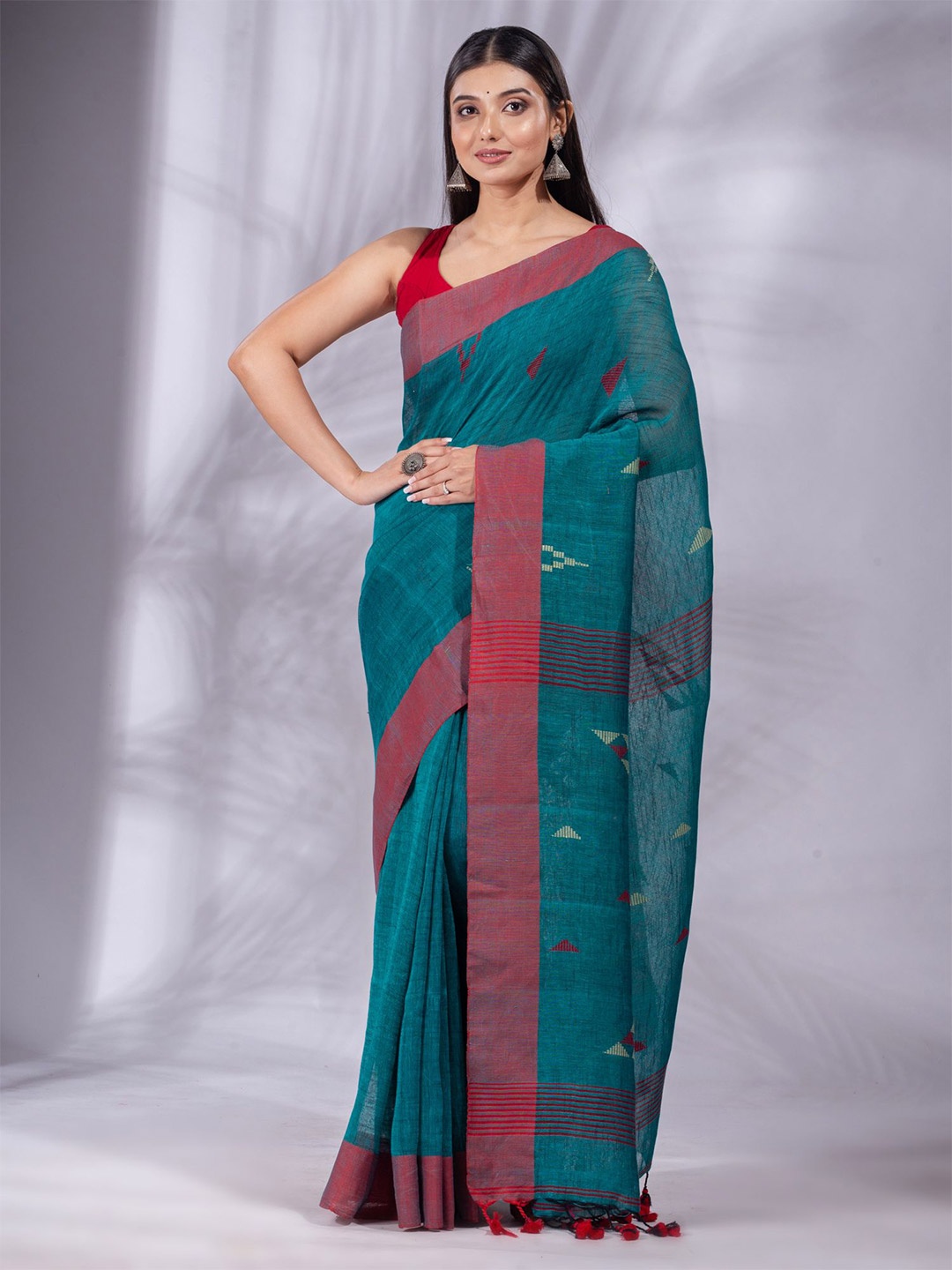 

Charukriti Teal & Maroon Pure Linen Saree