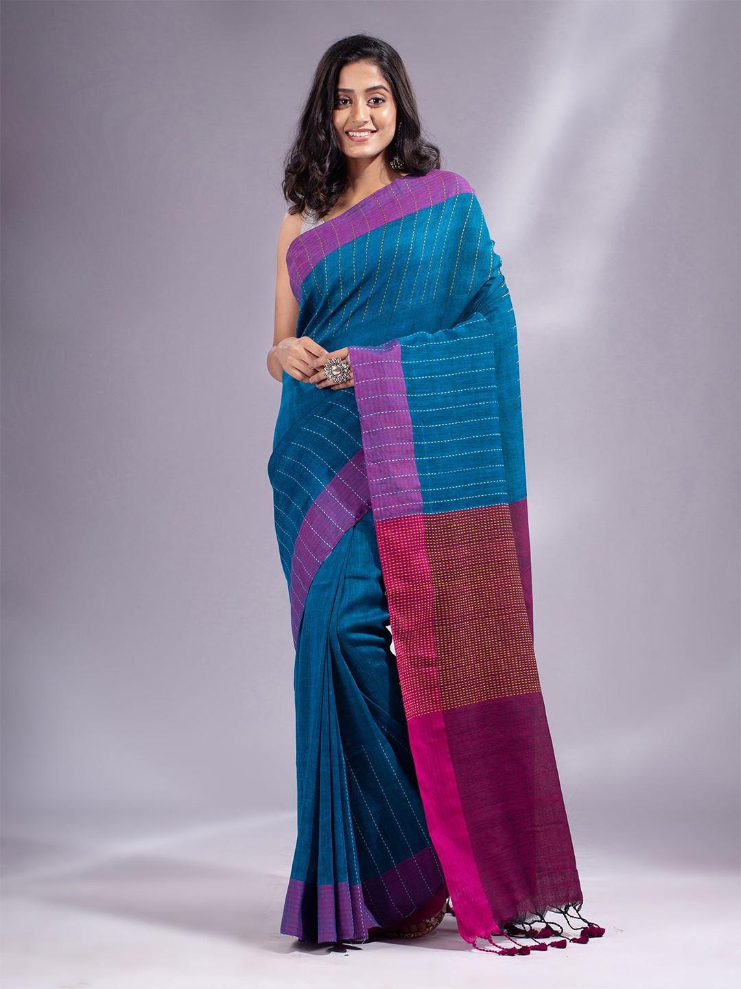 

Charukriti Blue & Pink Striped Linen Blend Saree
