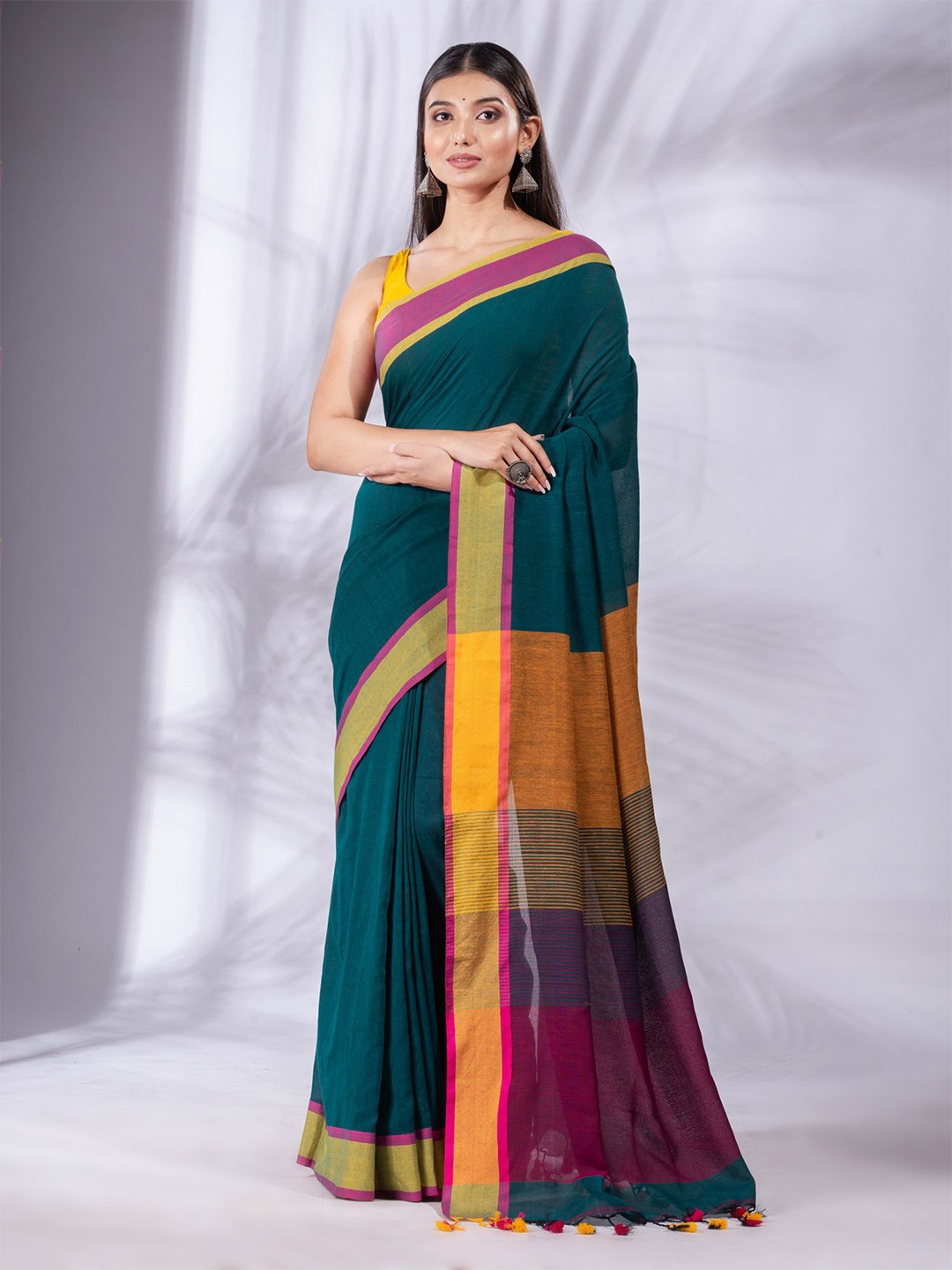 

Charukriti Teal Woven Design Pure Cotton Saree