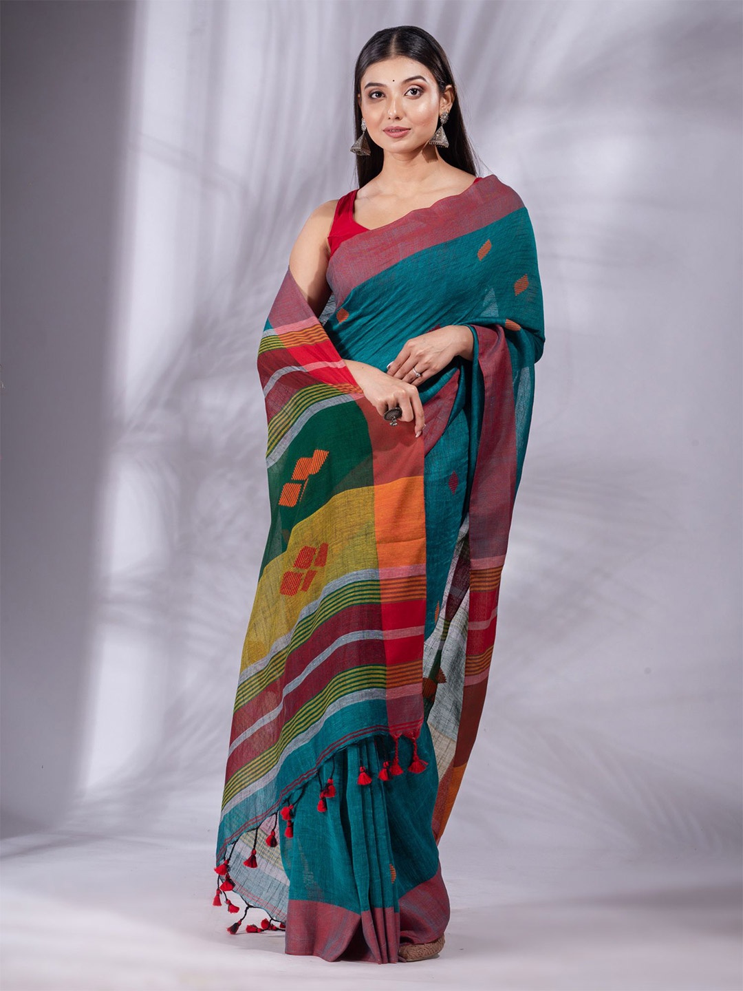 

Charukriti Teal & Mustard Pure Linen Ilkal Saree