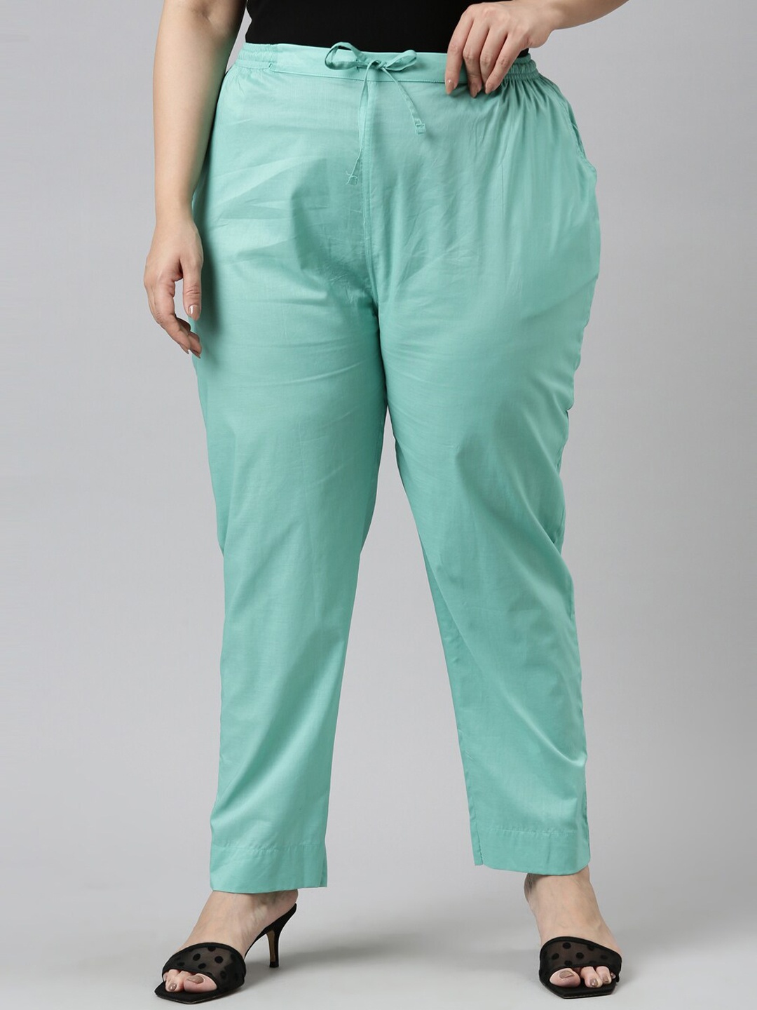 

Go Colors Plus Size Women Sea Green Solid Tapered Fit Trousers