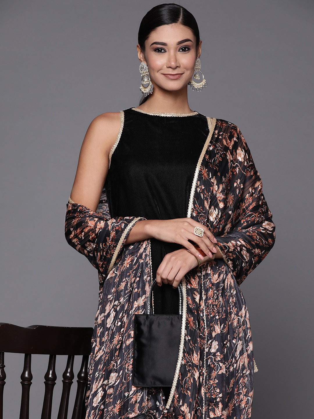 

Inddus Women Black Floral Velvet Kurta with Sharara & With Dupatta