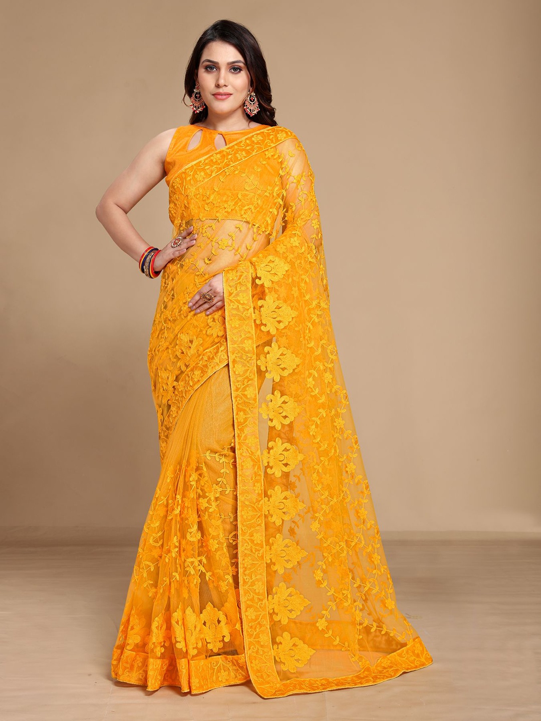 

VAIRAGEE Yellow Floral Embroidered Net Saree