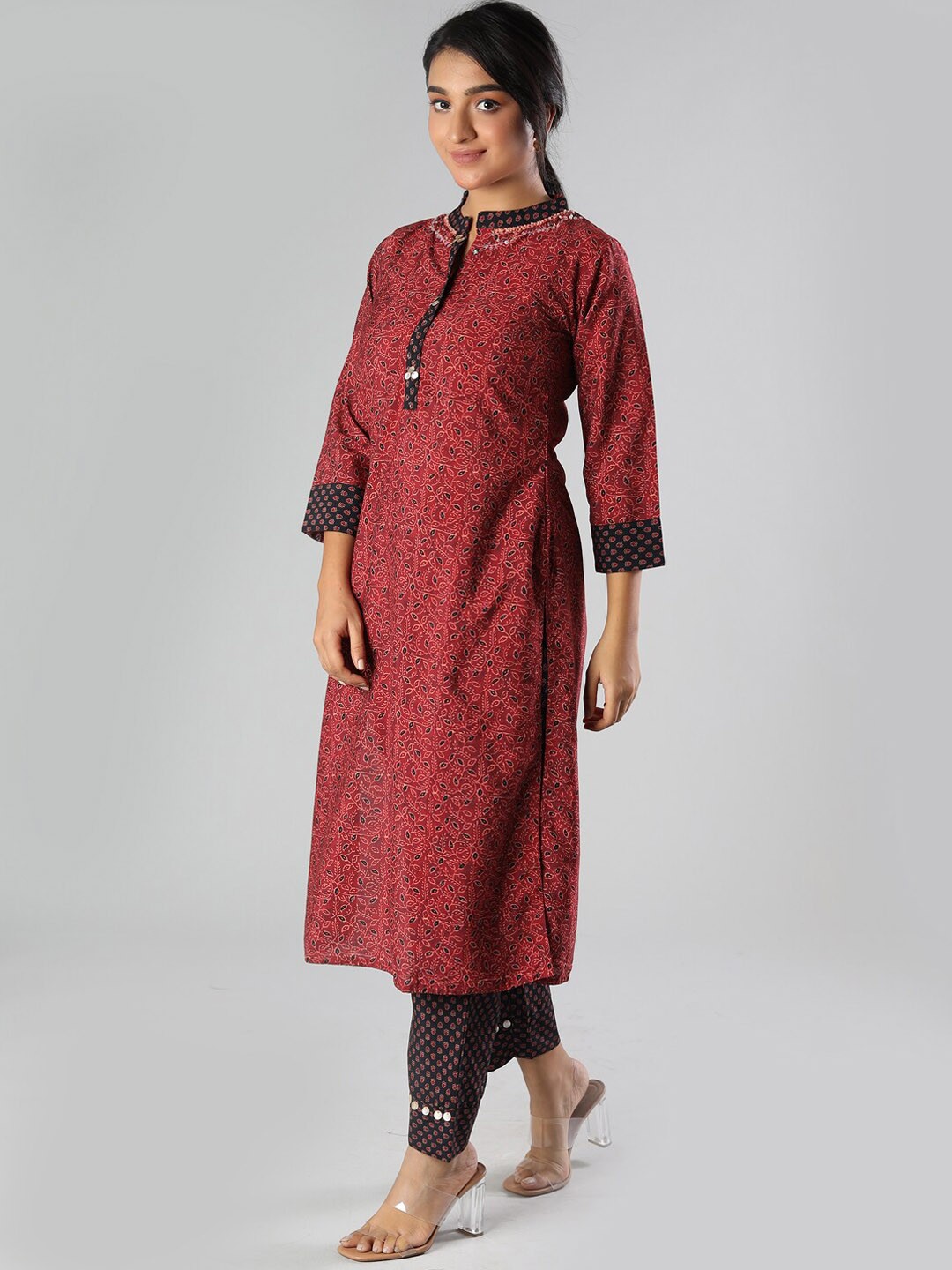 

taruni Women Maroon Embroidered Panelled Beads and Stones Kurti with Trousers