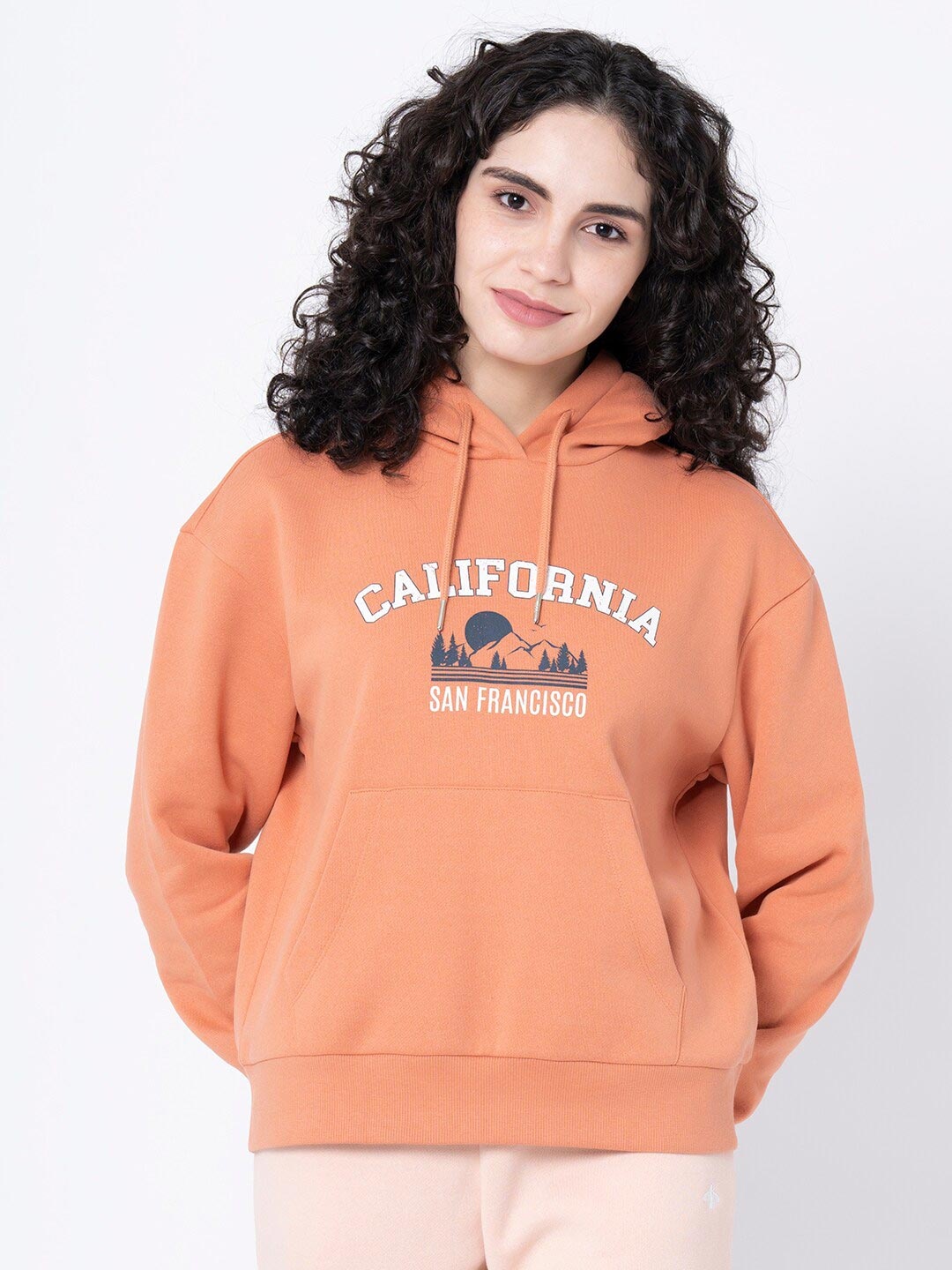 

Mode by Red Tape Women Orange Printed Hooded Sweatshirt