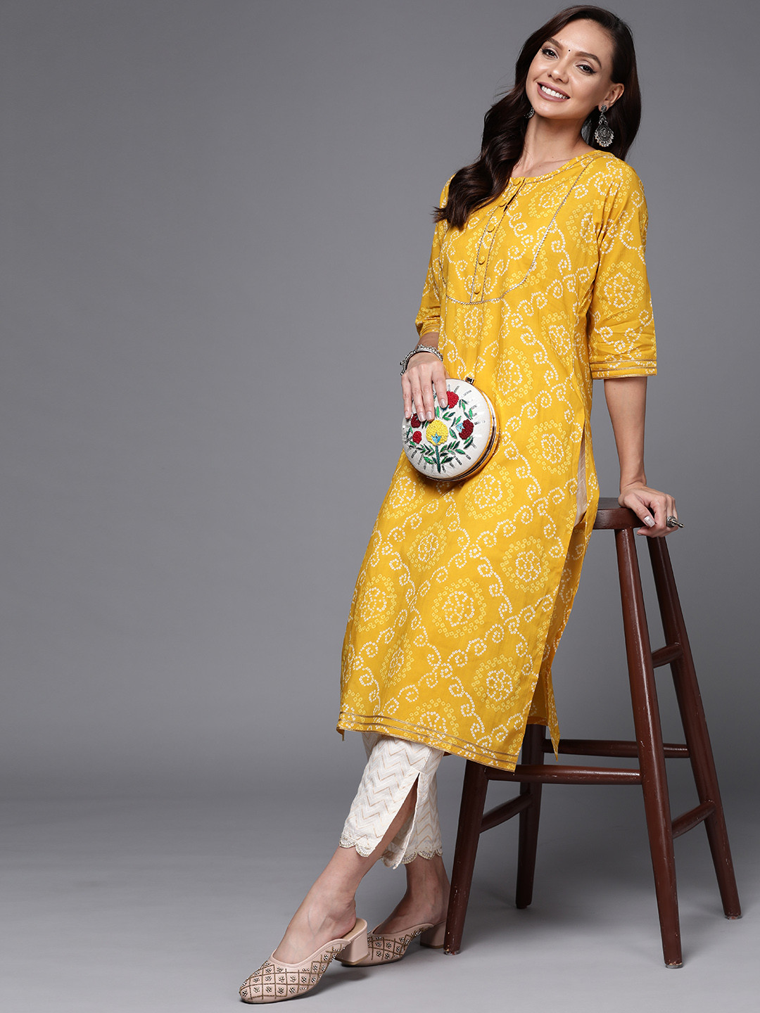 

Libas Women Yellow Bandhani Yoke Design Gotta Patti Kurta