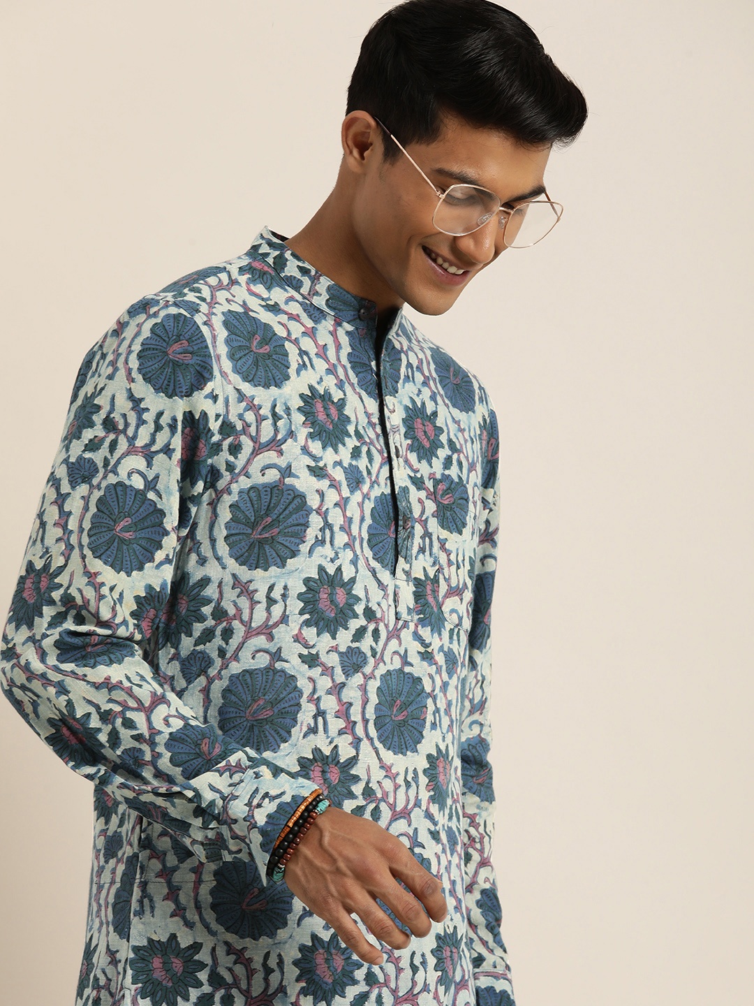 

Taavi Men Bagru Band Collar Floral Printed Pure Cotton Kurta with Trousers, Blue