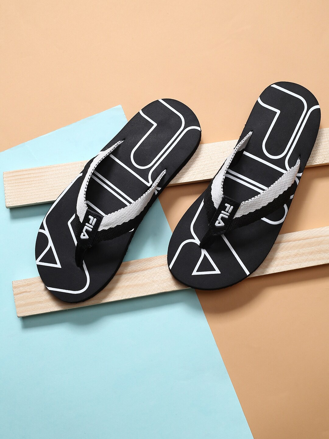 

FILA Men Black Printed MAGE Flip Flops