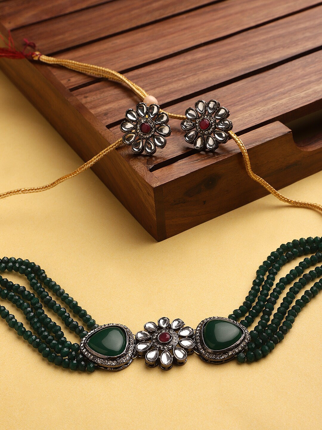 

CARDINAL Silver-Toned & Green Kundan Stone-Studded & Beaded Jewellery Set