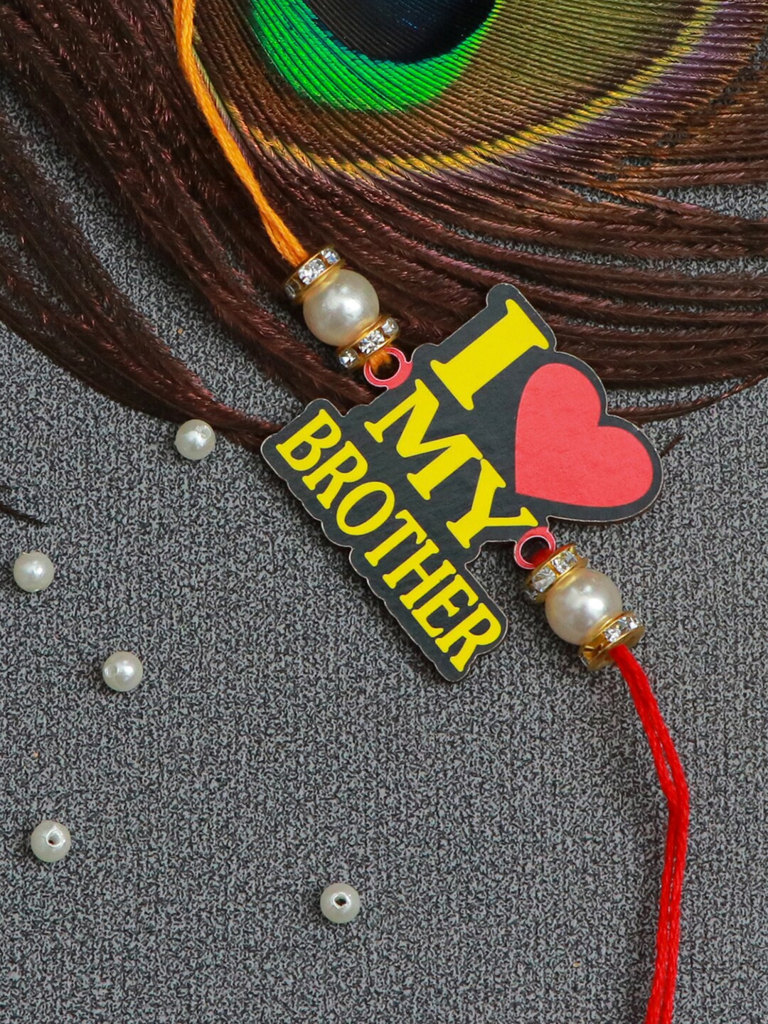 

The Magic Wand Boys Red & Yellow Pearls Beaded Quote Rakhi