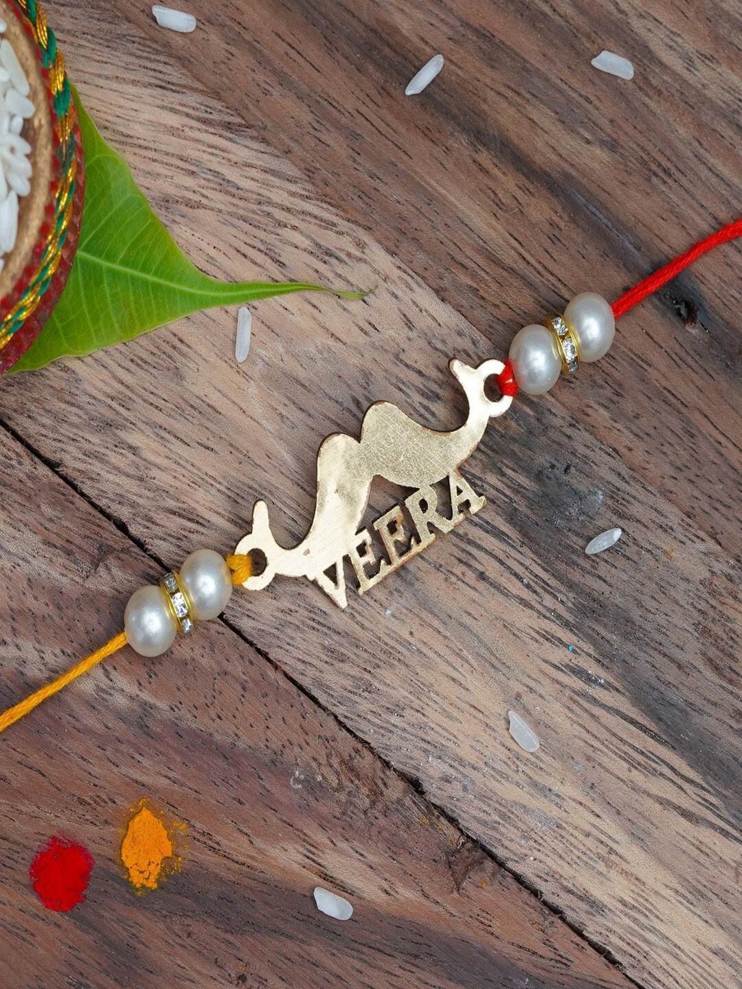 

The Magic Wand Boys Gold-Toned & White Pearls Beaded Rakhi