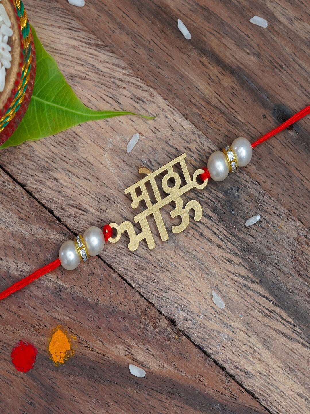 

The Magic Wand Gold-Toned & White Pearls Beaded Rakhi