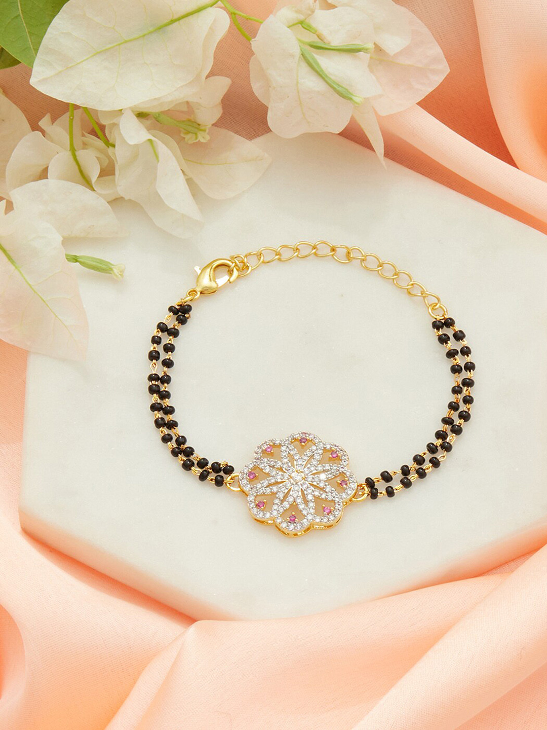 

Voylla Women Gold-Toned & Black Brass American Diamond Gold-Plated Charm Bracelet