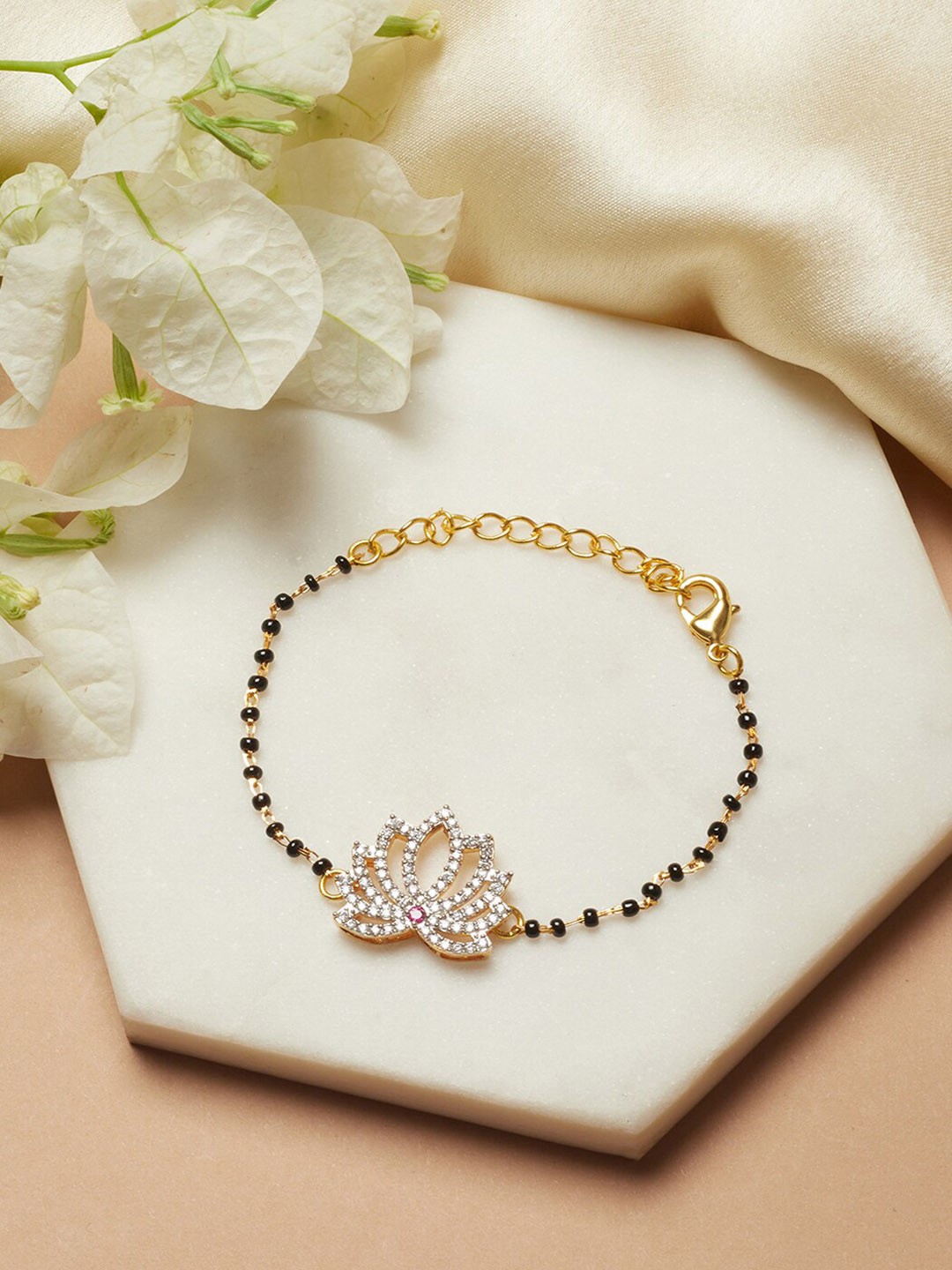 

Voylla Women Gold-Toned & Black Brass American Diamond Gold-Plated Link Bracelet