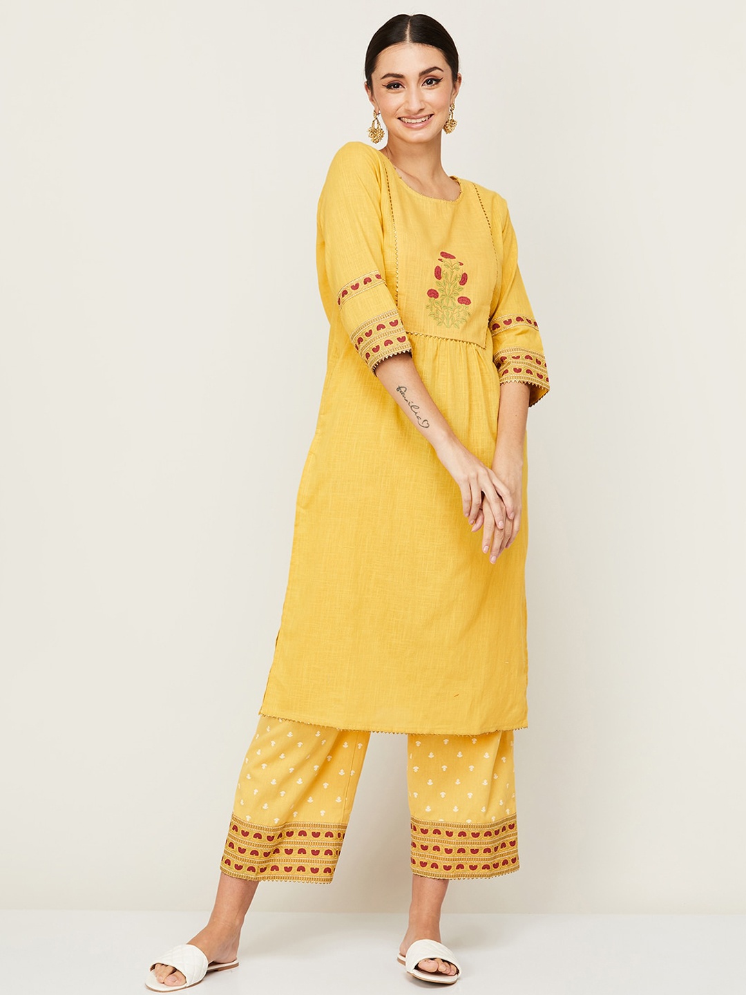 

Melange by Lifestyle Women Yellow Yoke Design Pleated Pure Cotton Kurti with Trousers