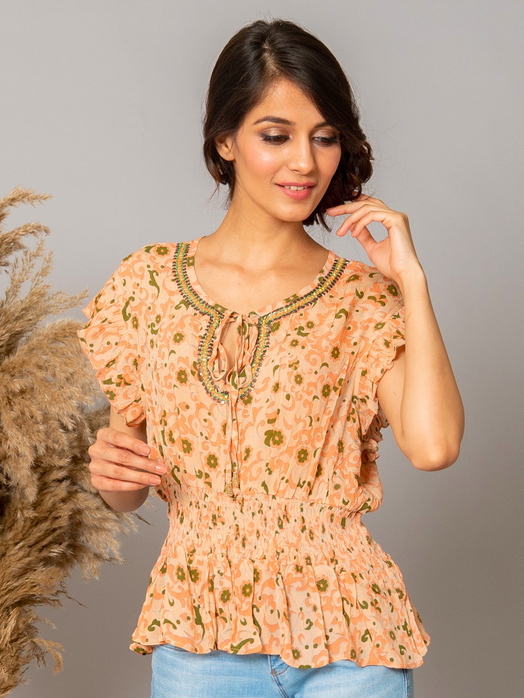 

WESTIFIED Women Peach-Coloured Floral Print Tie-Up Neck Chiffon Cinched Waist Top