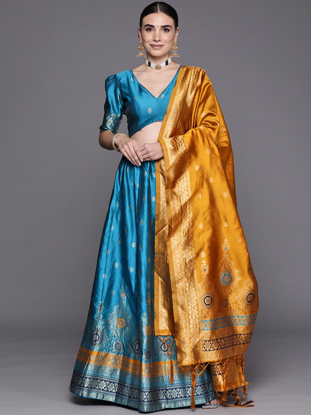 

Mitera Turquoise Blue Semi-Stitched Lehenga & Unstitched Blouse With Dupatta