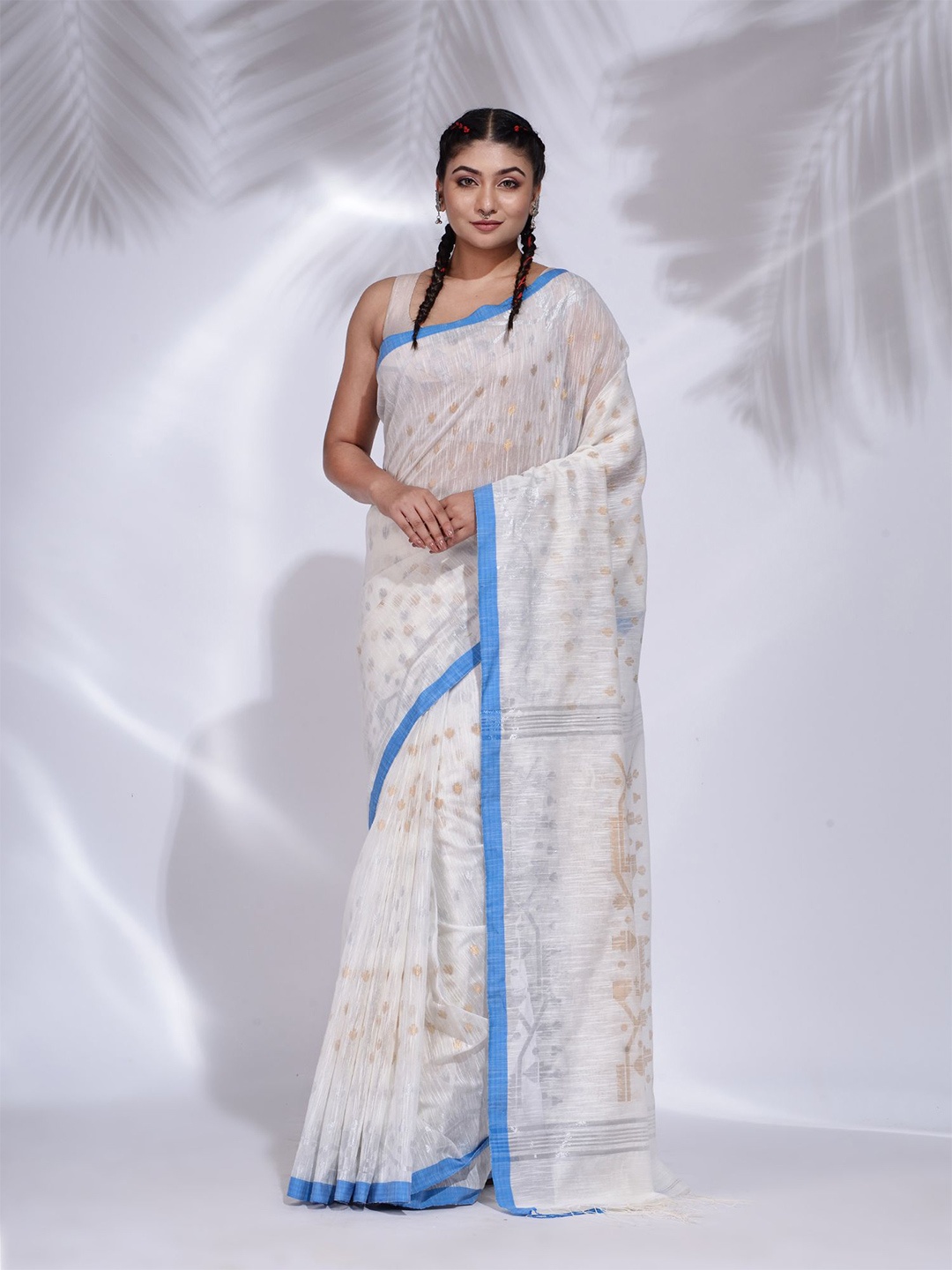 

Charukriti White & Blue Ethnic Motifs Zari Pure Cotton Saree