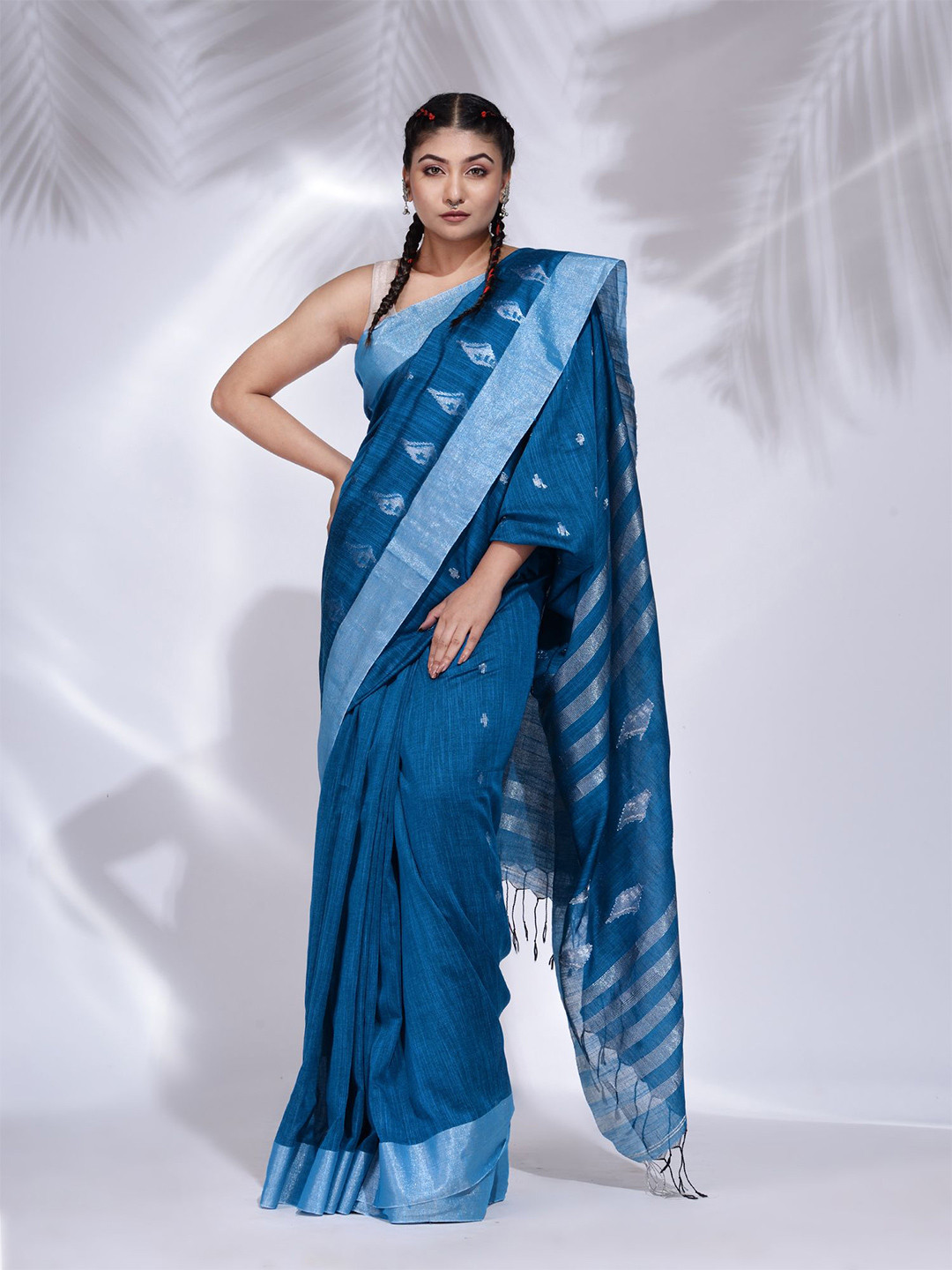 

Charukriti Blue & Silver-Toned Ethnic Motifs Zari Pure Cotton Saree