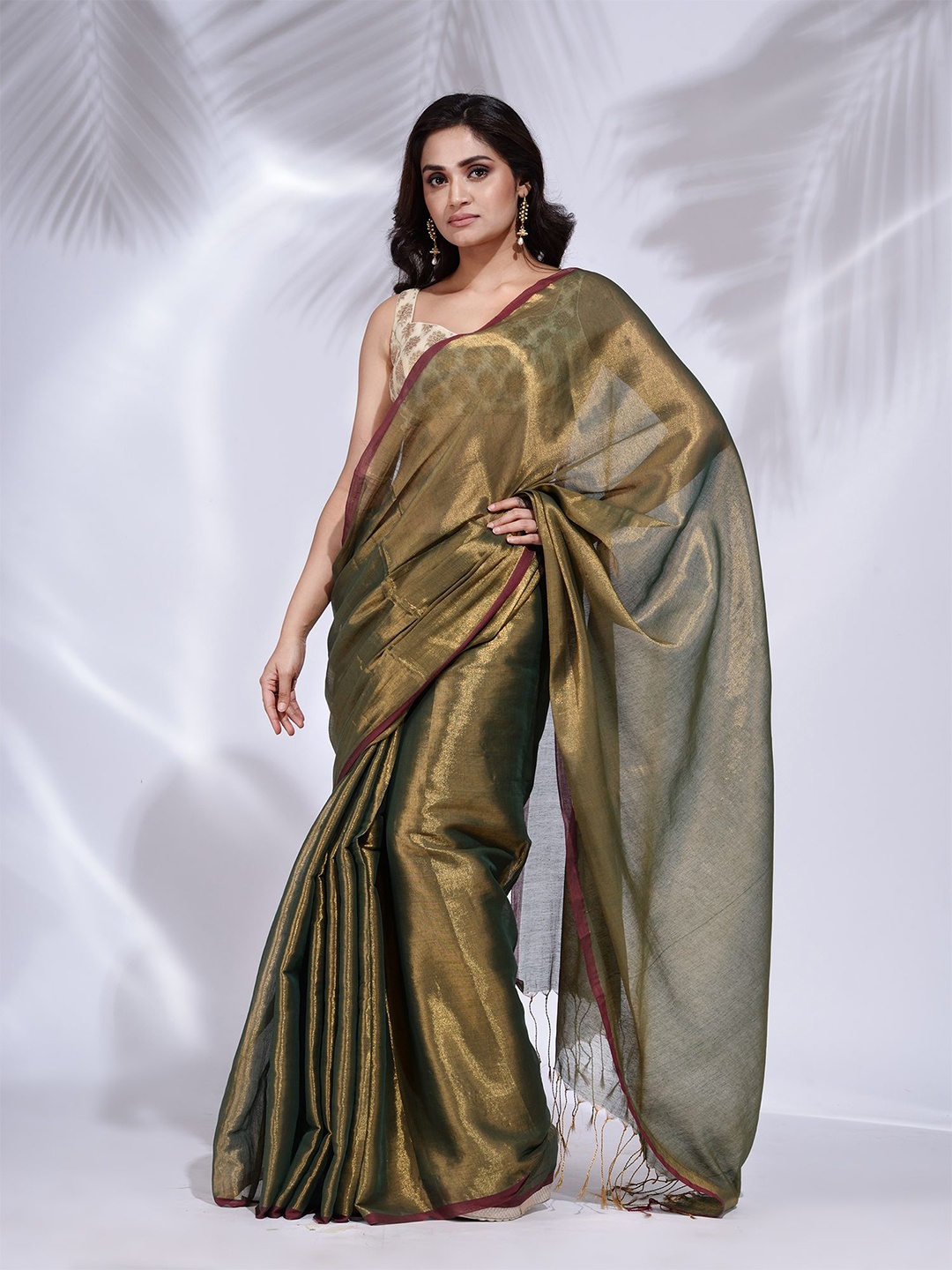 

Charukriti Gold-Toned Tissue Saree