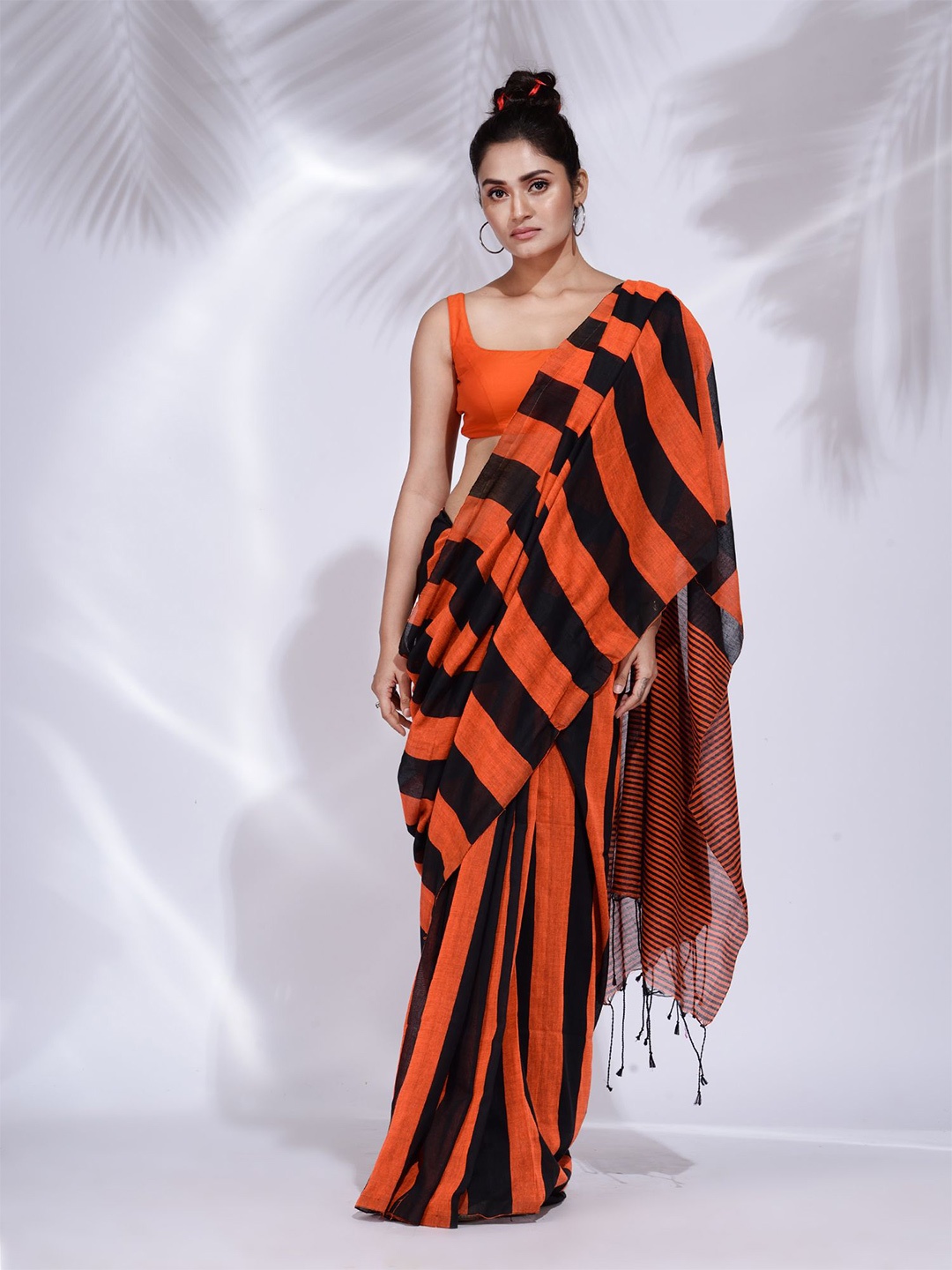 

Charukriti Orange & Black Woven Design Pure Cotton Saree