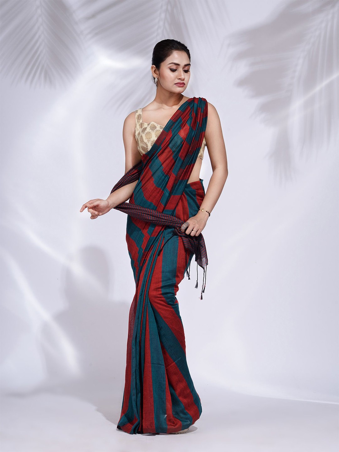 

Charukriti Red & Teal Striped Pure Cotton Saree