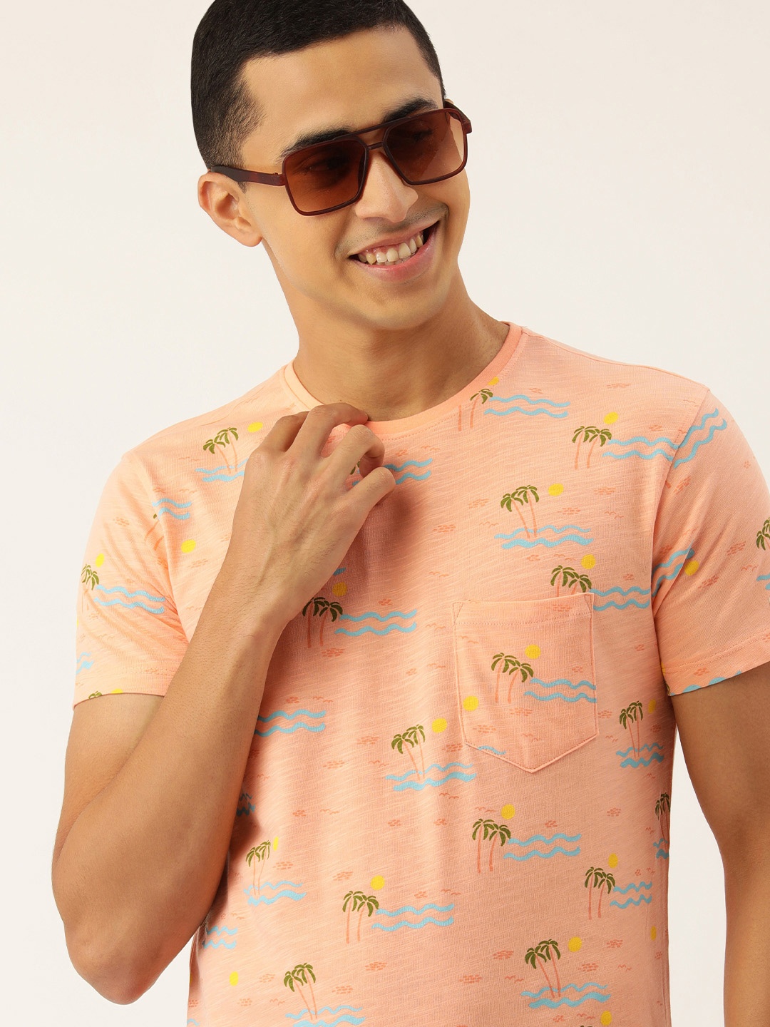 

Peter England Casuals Men Peach-Coloured & Blue Tropical Printed T-shirt